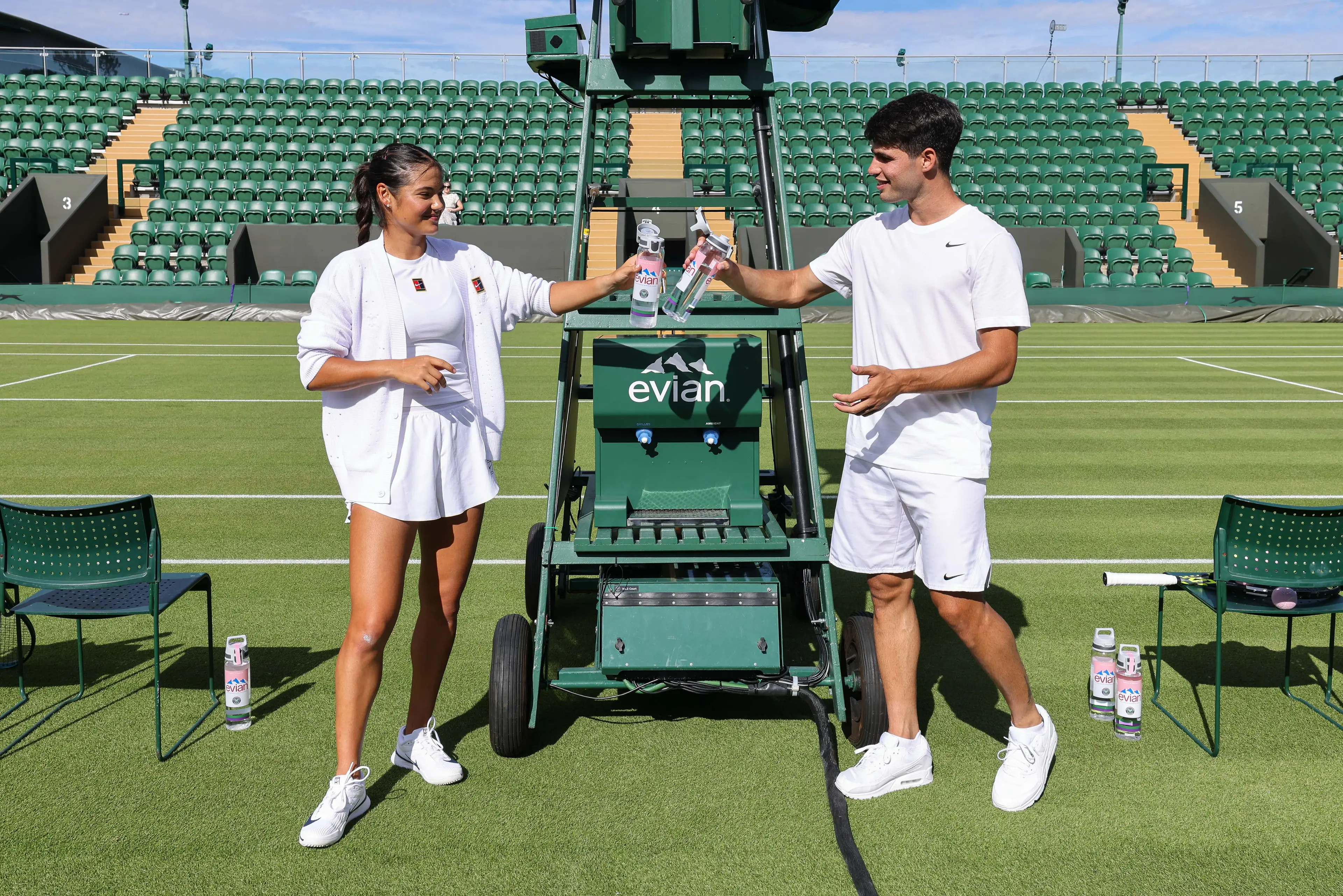 Emma Raducanu and Carlos Alcaraz posed for an Evian photoshoot. Image: Getty