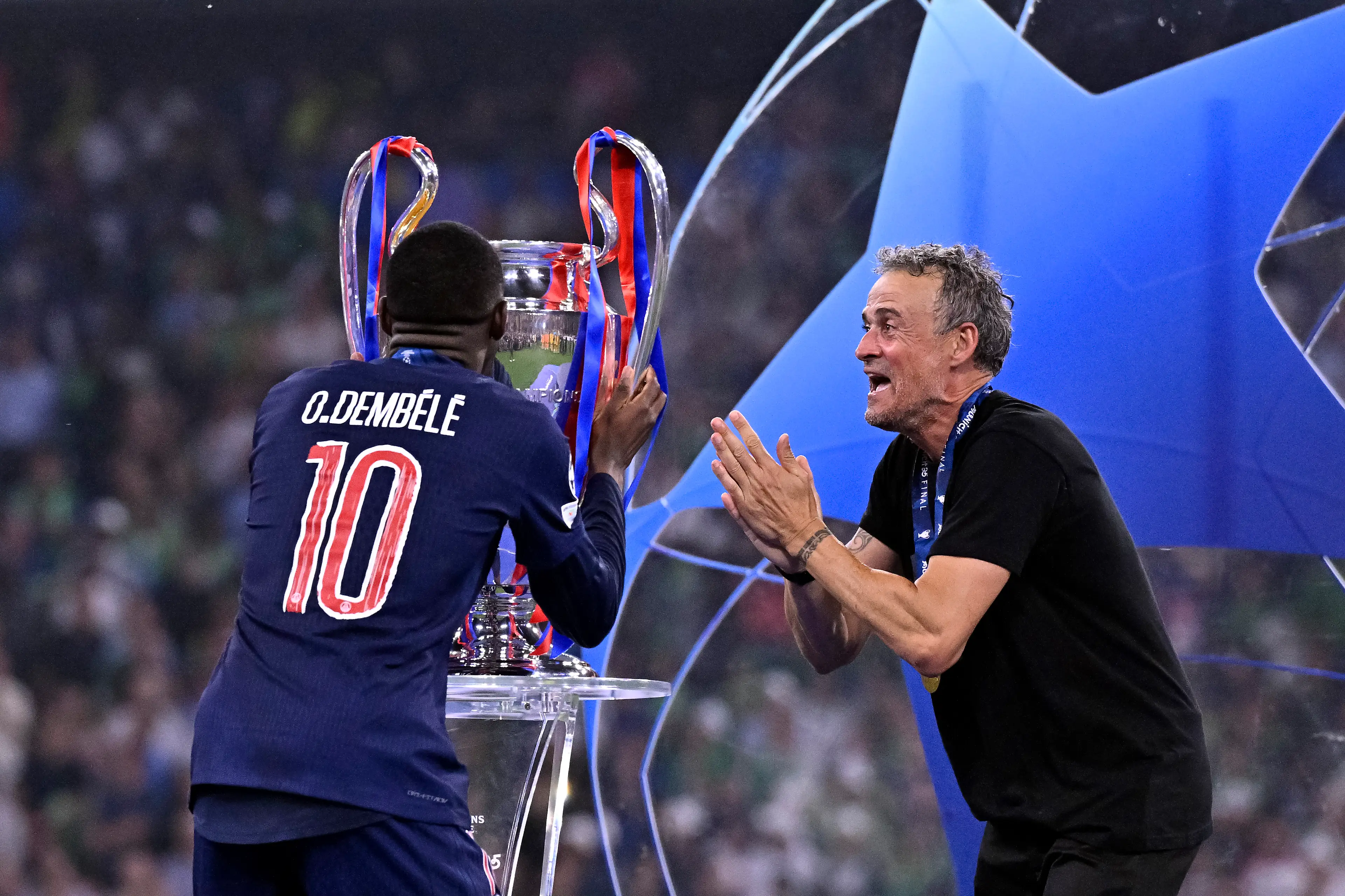Luis Enrique and Ousmane Dembele celebrate PSG's Champions League win / Photo by Aurelien Meunier - PSG/PSG via Getty Images
