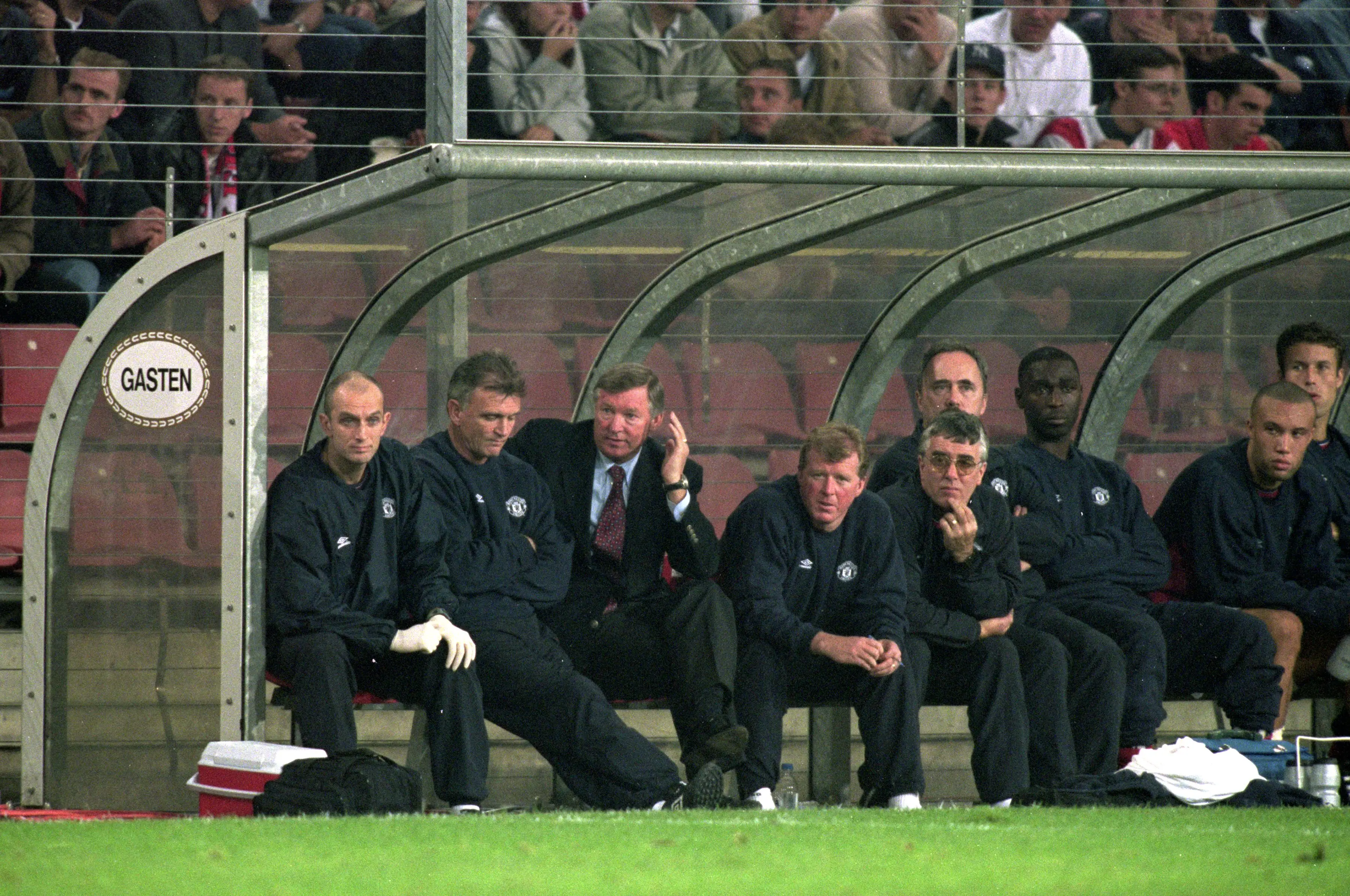 Ferguson sits beside his assistants, Jim Ryan and Steve McClaren. Image credit: Getty