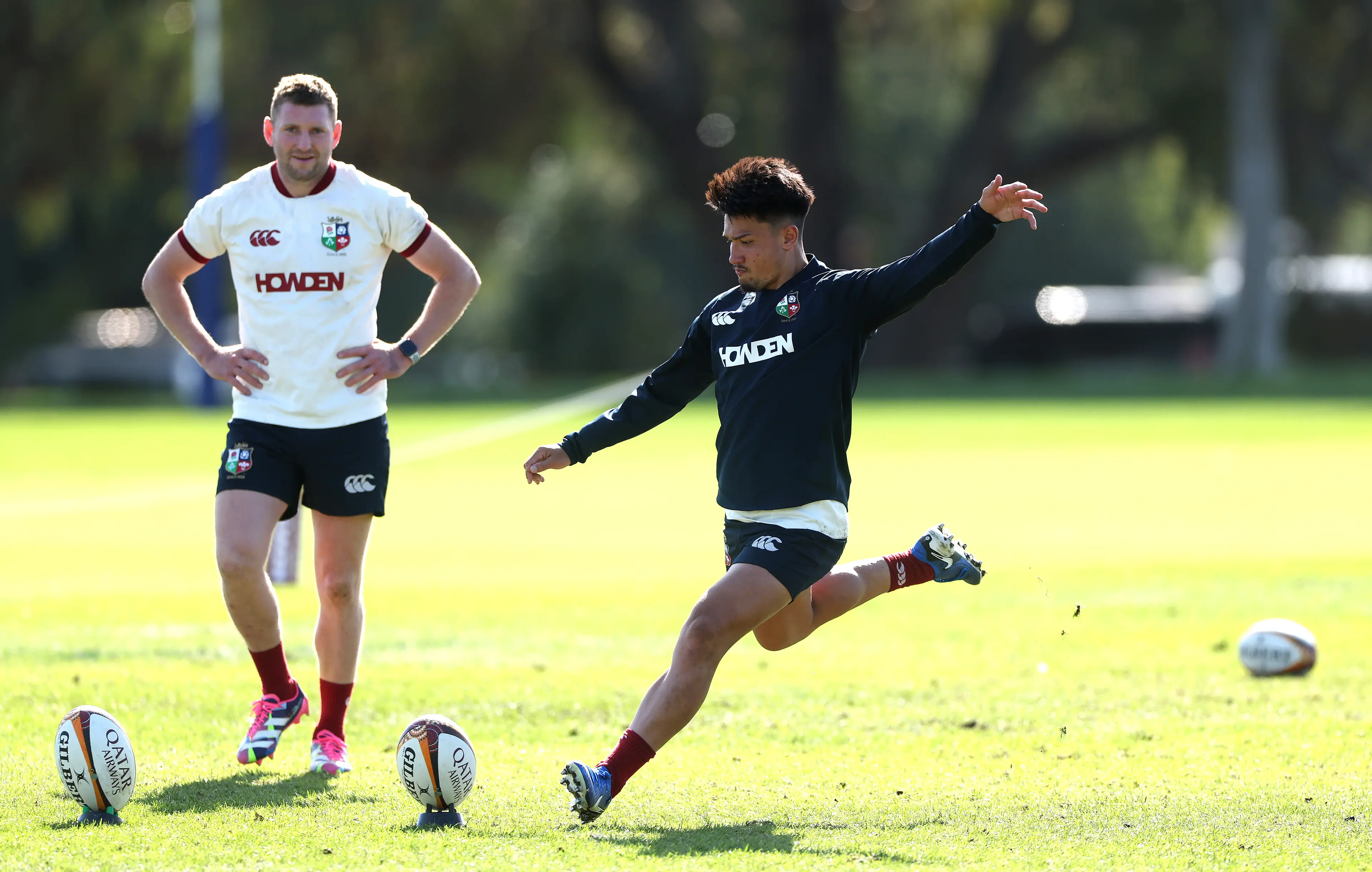 Marcus Smith practices his kicking watched by team mate Finn Russell during the British & Irish Lions training session (Getty Images)
