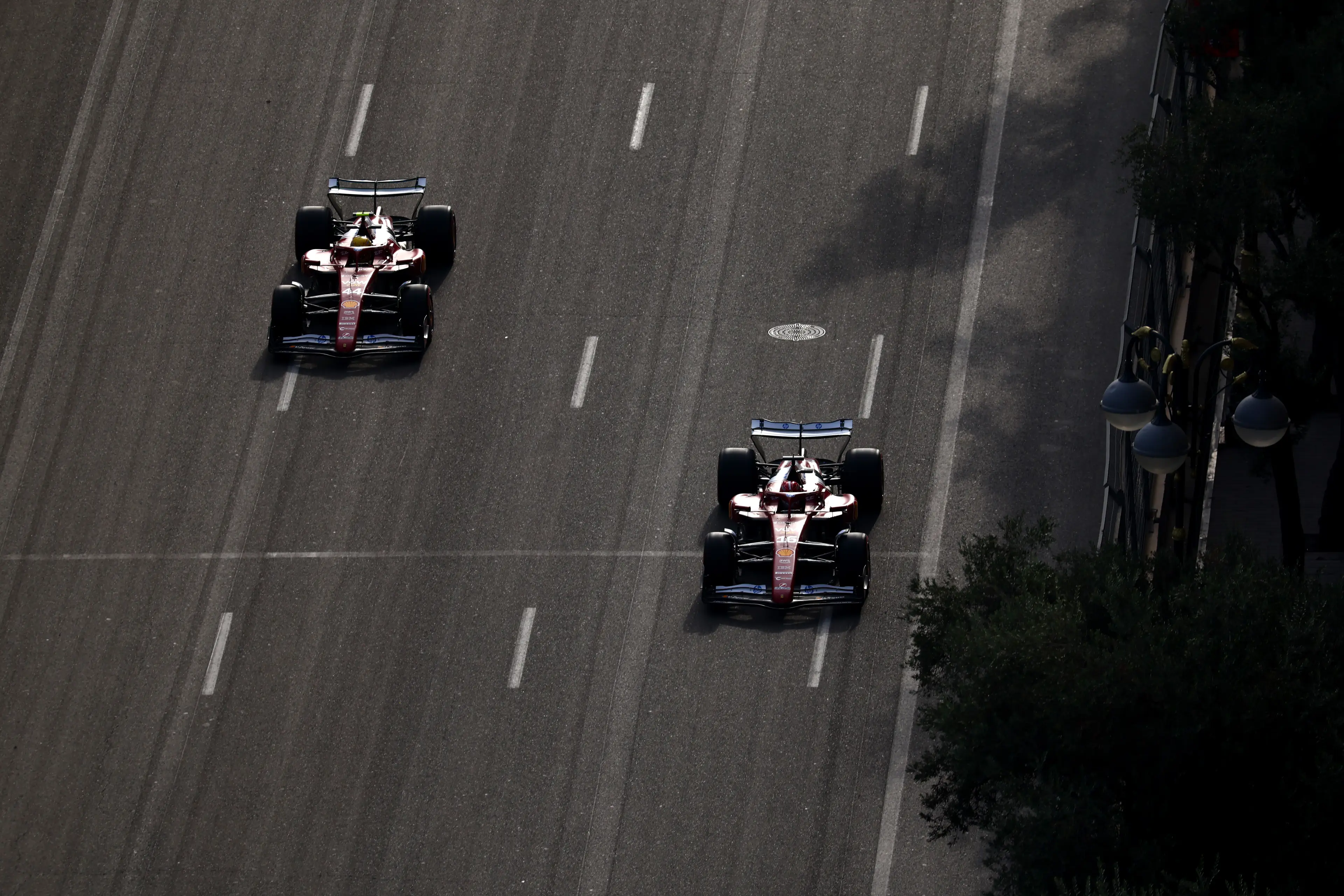 Lewis Hamilton and Charles Leclerc swapping positions in Baku (credit: getty)