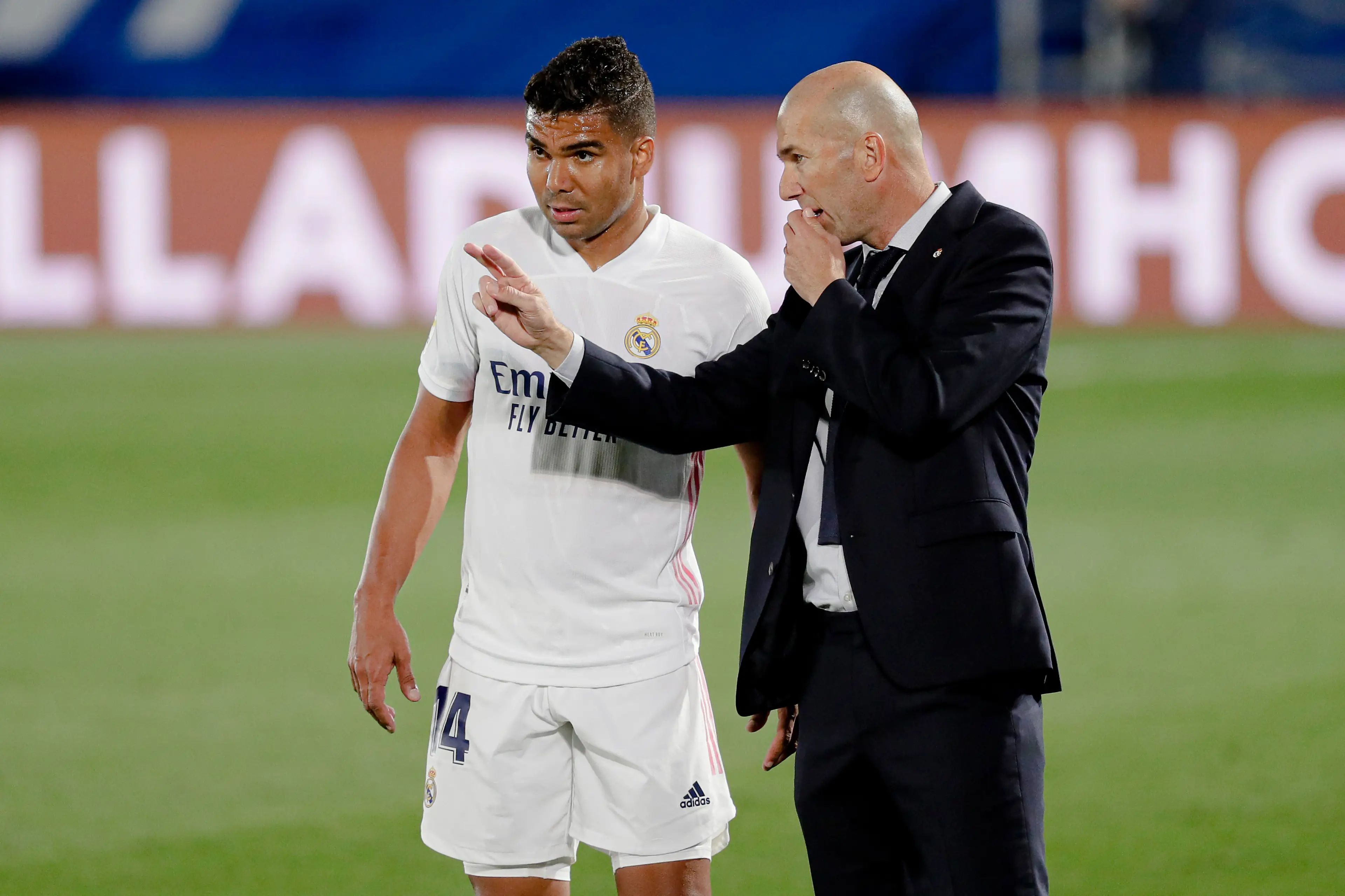 Casemiro and Zinedine Zidane in conversation during a Real Madrid game. Image: Getty