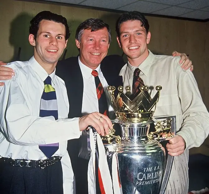 Ryan Giggs, Sir Alex Ferguson and Lee Sharpe pose with the Premier League trophy in 1994 (Image: Getty)