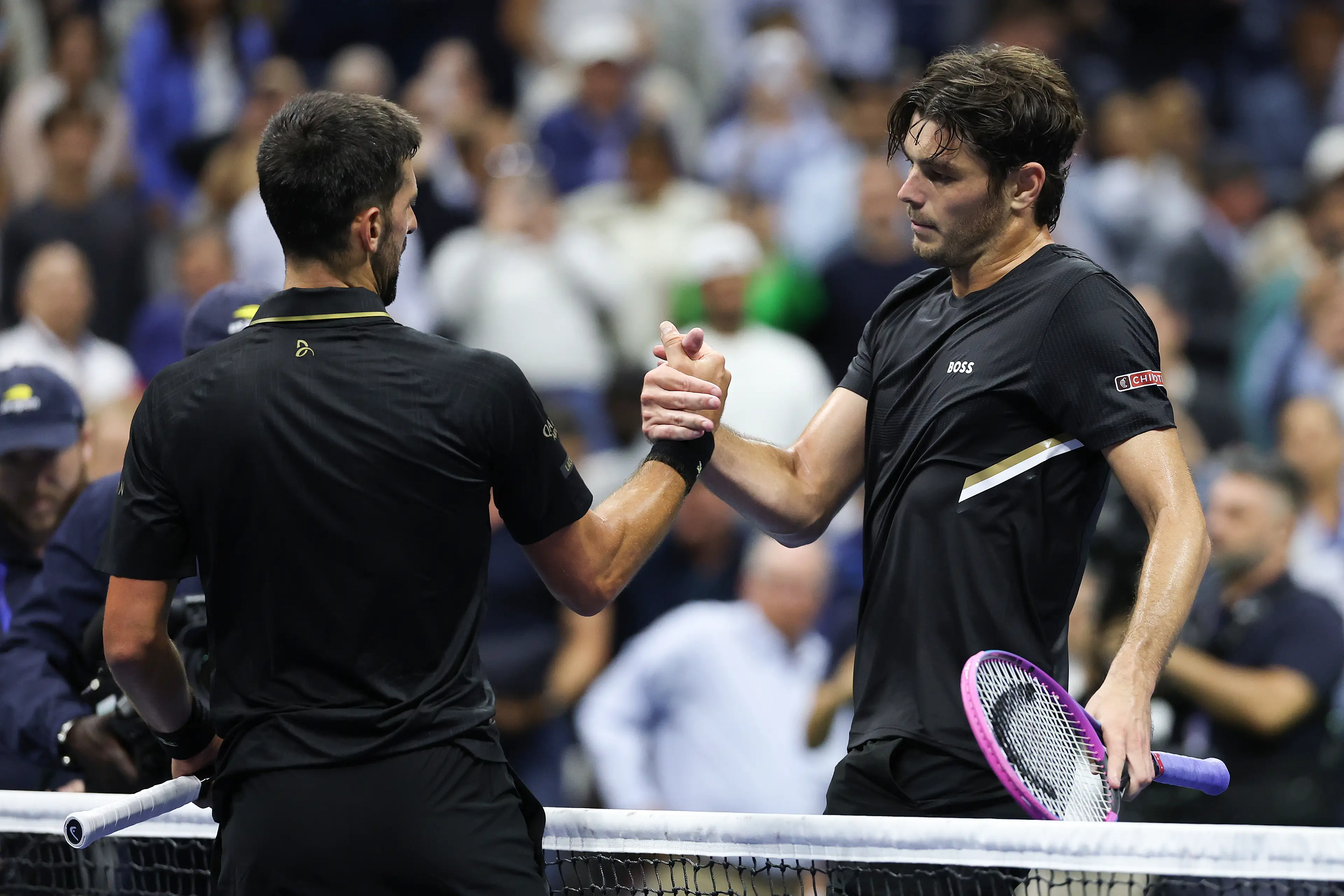 Novak Djokovic and Taylor Fritz. Image: Clive Brunskill / Staff via Getty