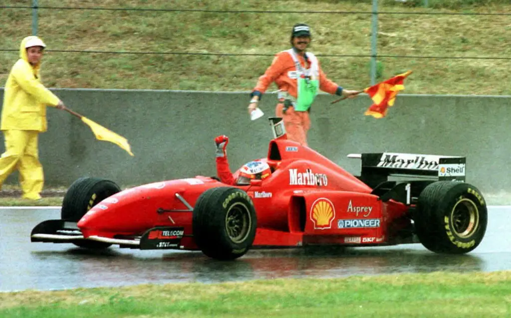 A memorable moment in 1996 as Schumacher celebrated his first Ferrari win and marking his 20th F1 victory in a rainy Barcelona