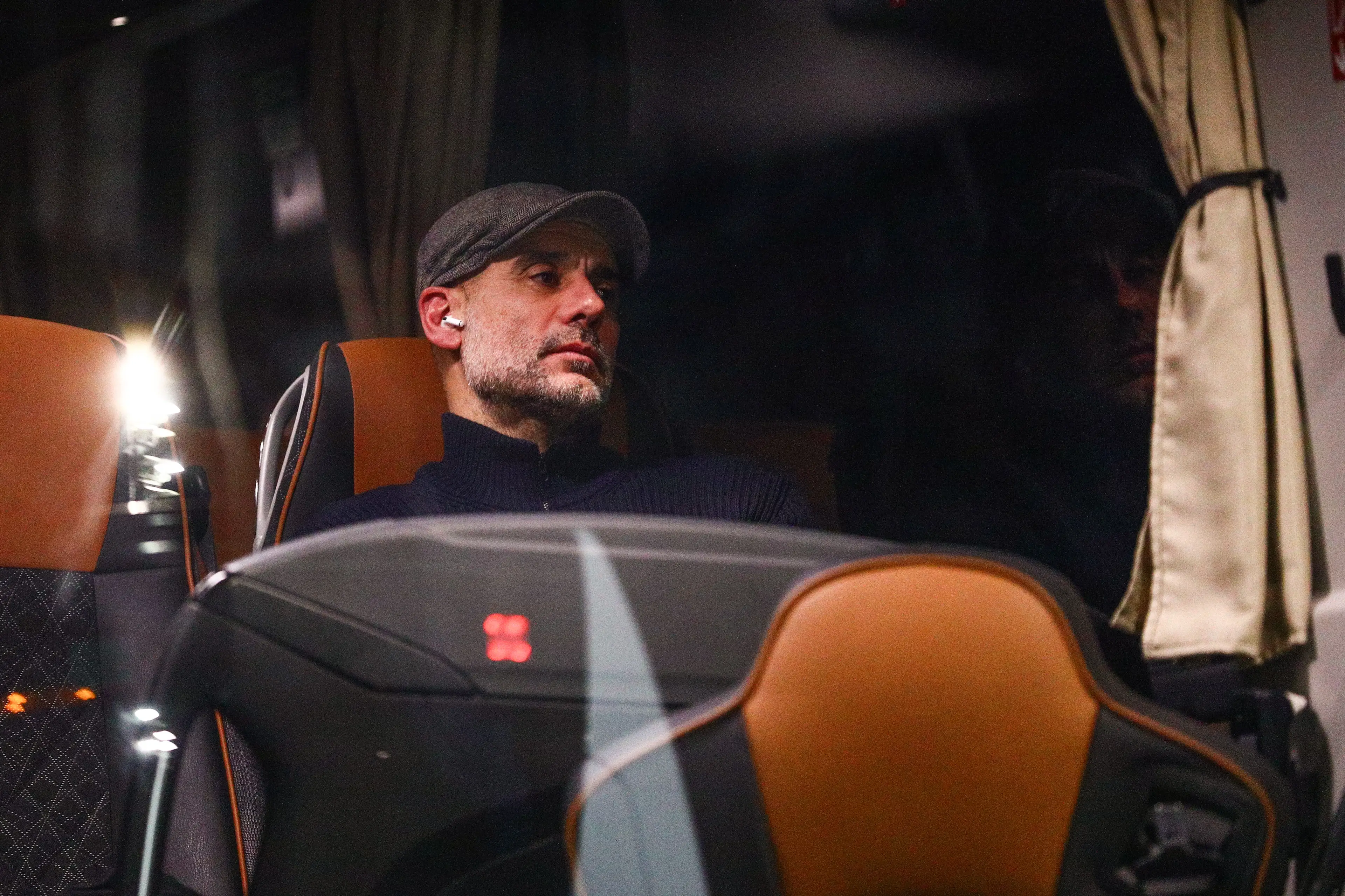 Guardiola sits on the team coach following their loss on Tuesday night. Image credit: Getty