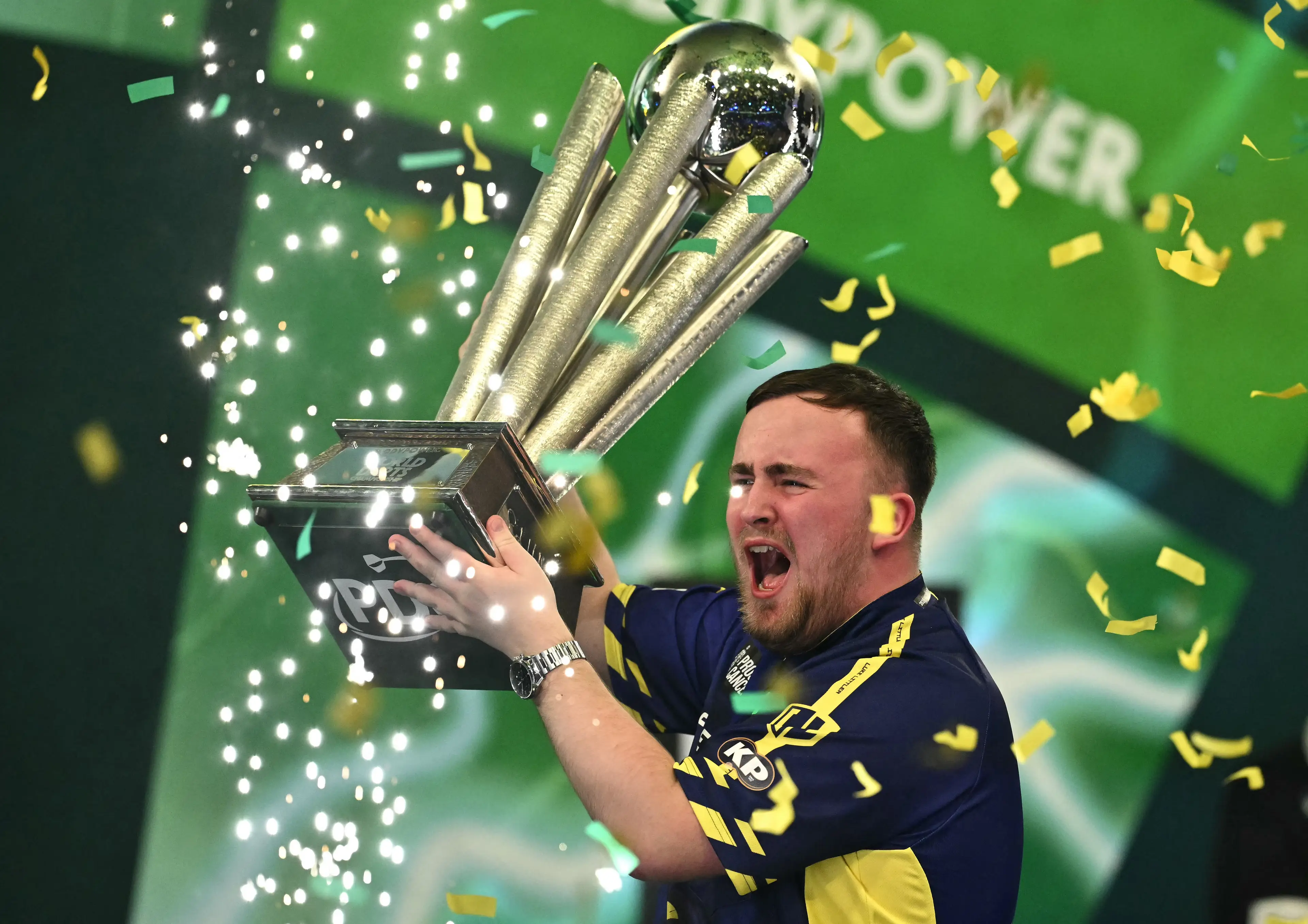 Luke Littler celebrates winning the World Darts Championship. Image: Getty 