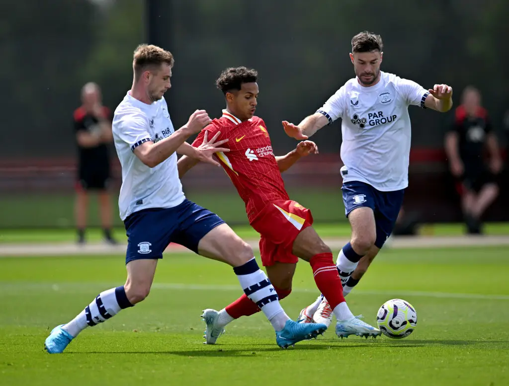 Liverpool's Fabio Carvalho battles for the ball against PNE's Liam Lindsay and Andrew Hughes -