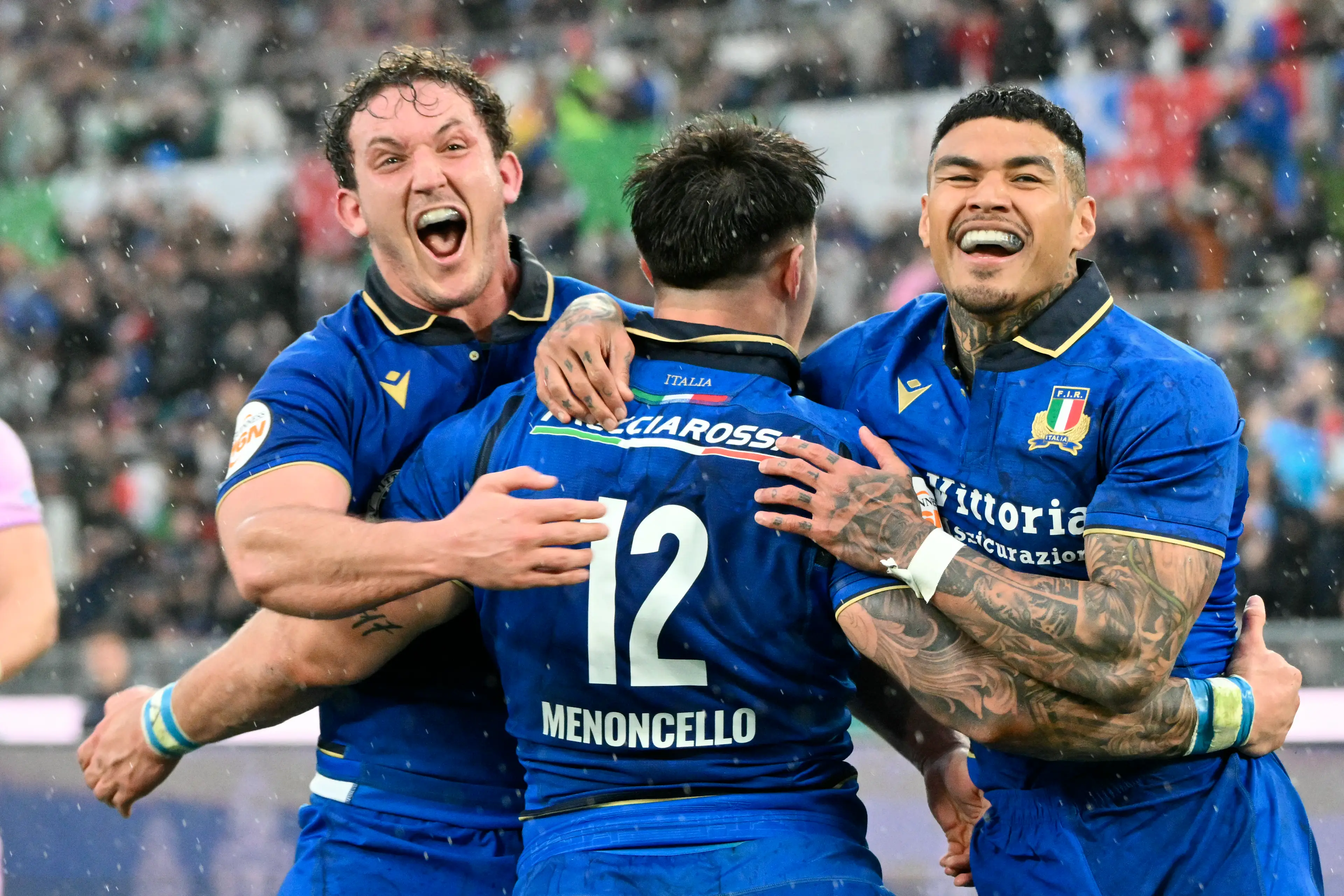 Tommaso Menoncello is congratulated by teammates after scoring a try during the Six Nations international rugby union match between Italy and Scotland (Getty Images)