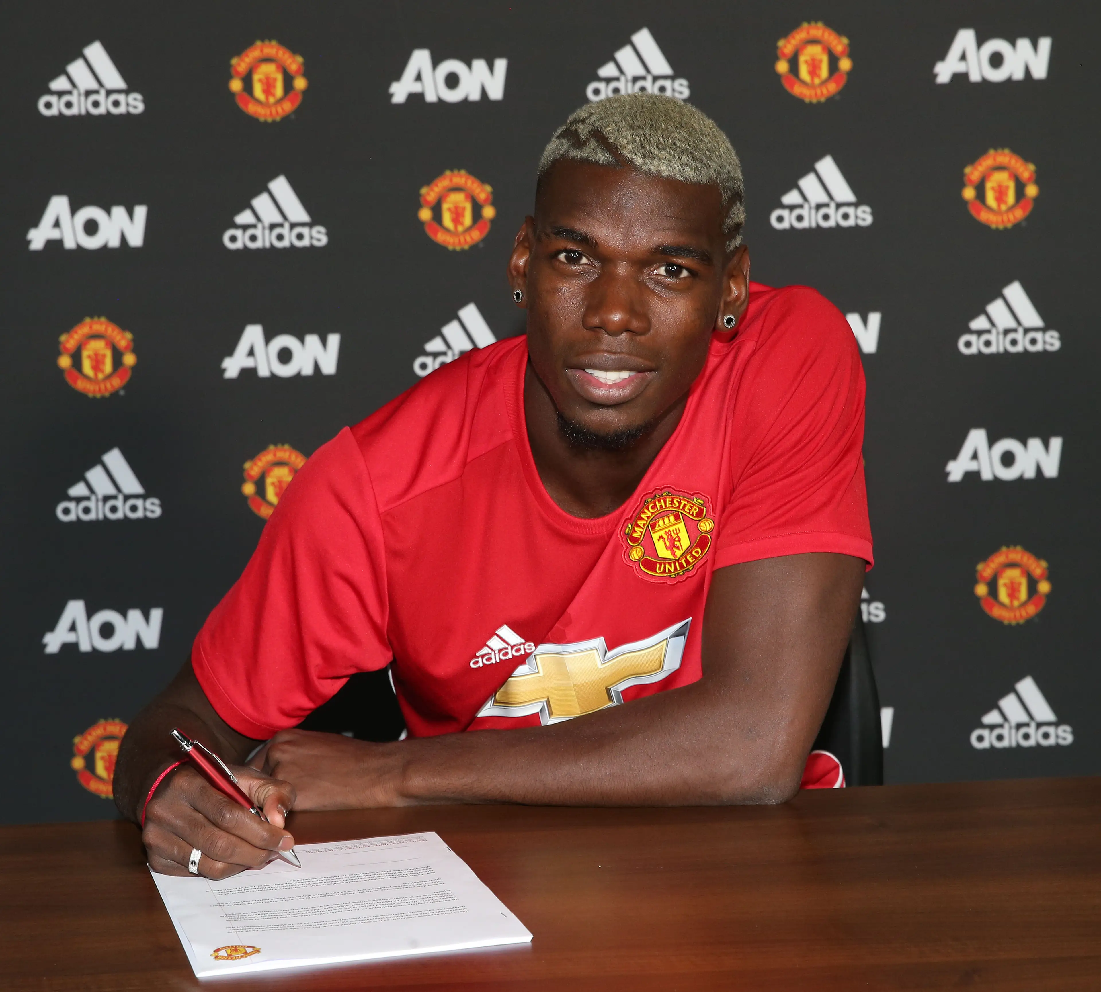 Paul Pogba signing for Man Utd in 2016 (credit: getty)