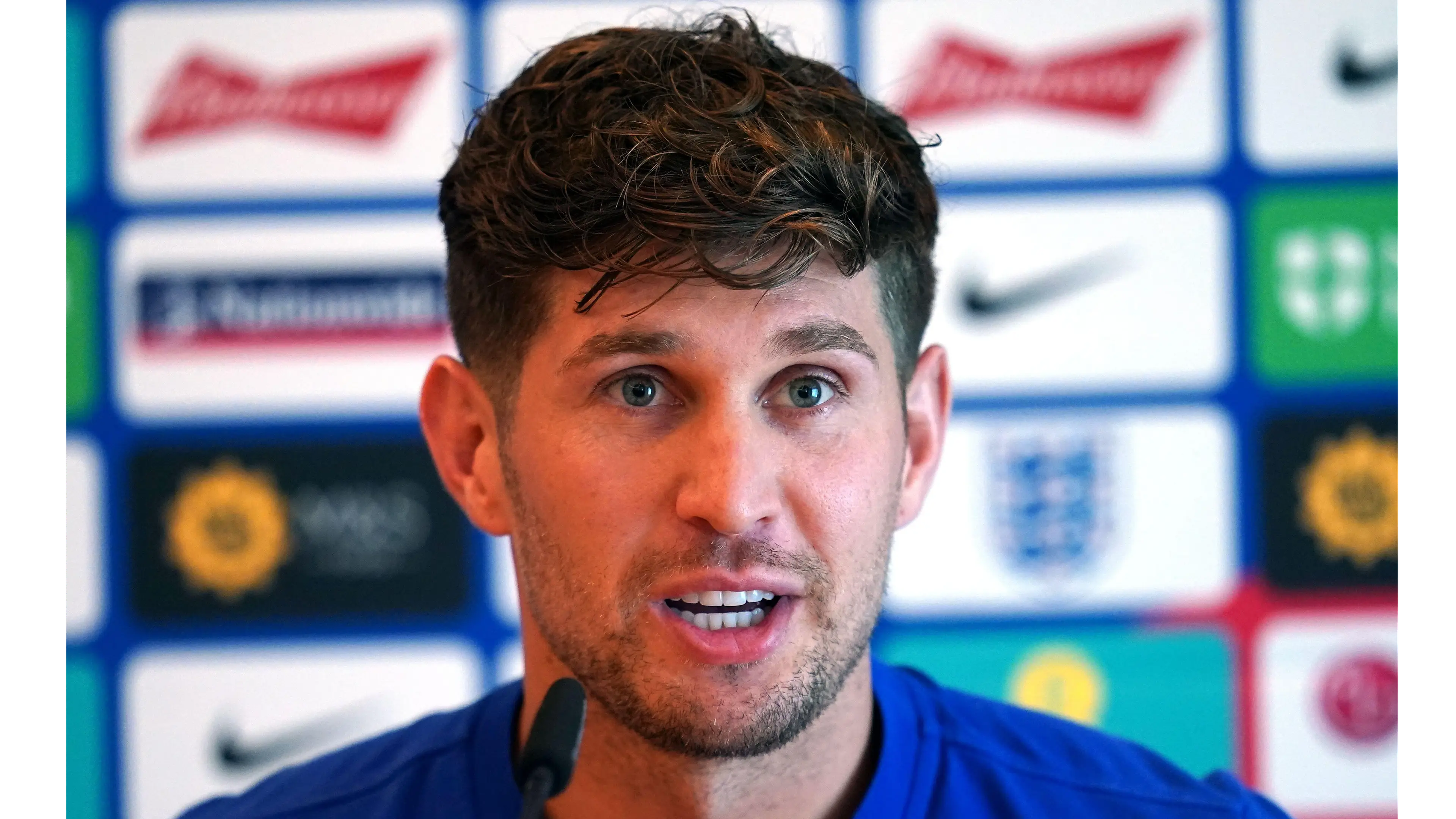 John Stones speaking to the press while on international duty with England.
