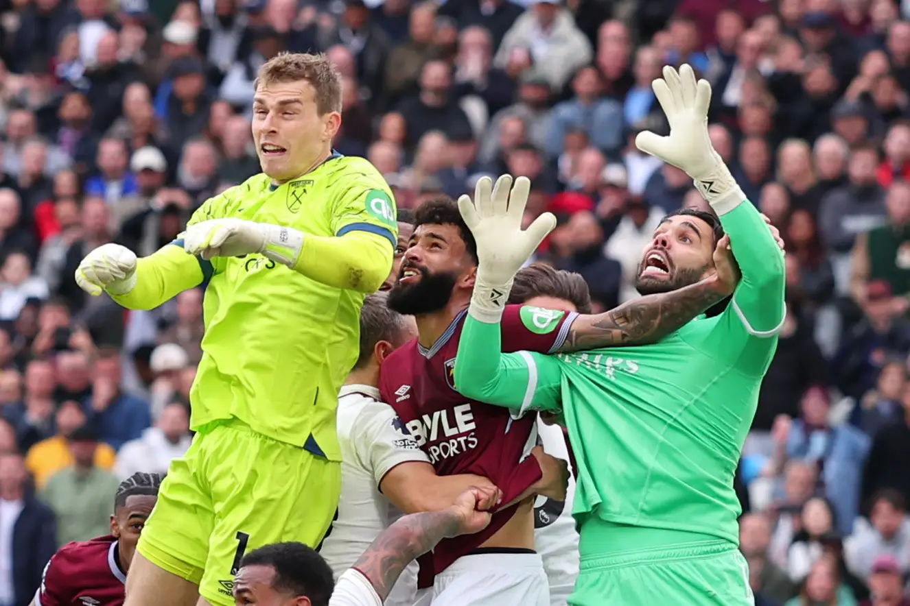 Pablo of West Ham United fouls David Raya of Arsenal resulting in a late equalising goal for West Ham being disallowed by VAR. Image credit: Getty