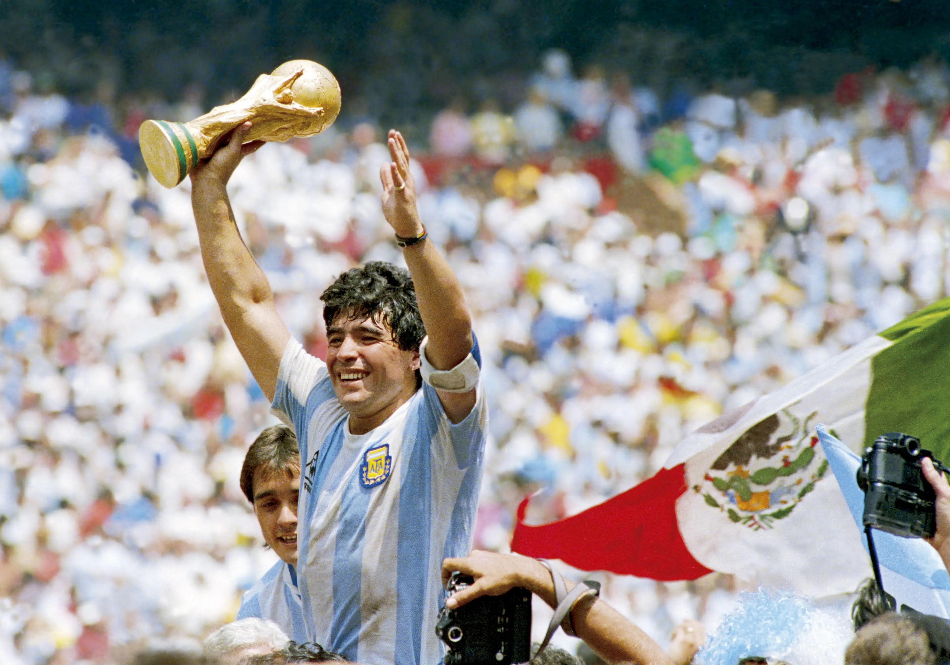 Diego Maradona celebrates winning the World Cup with Argentina. Image: Getty 