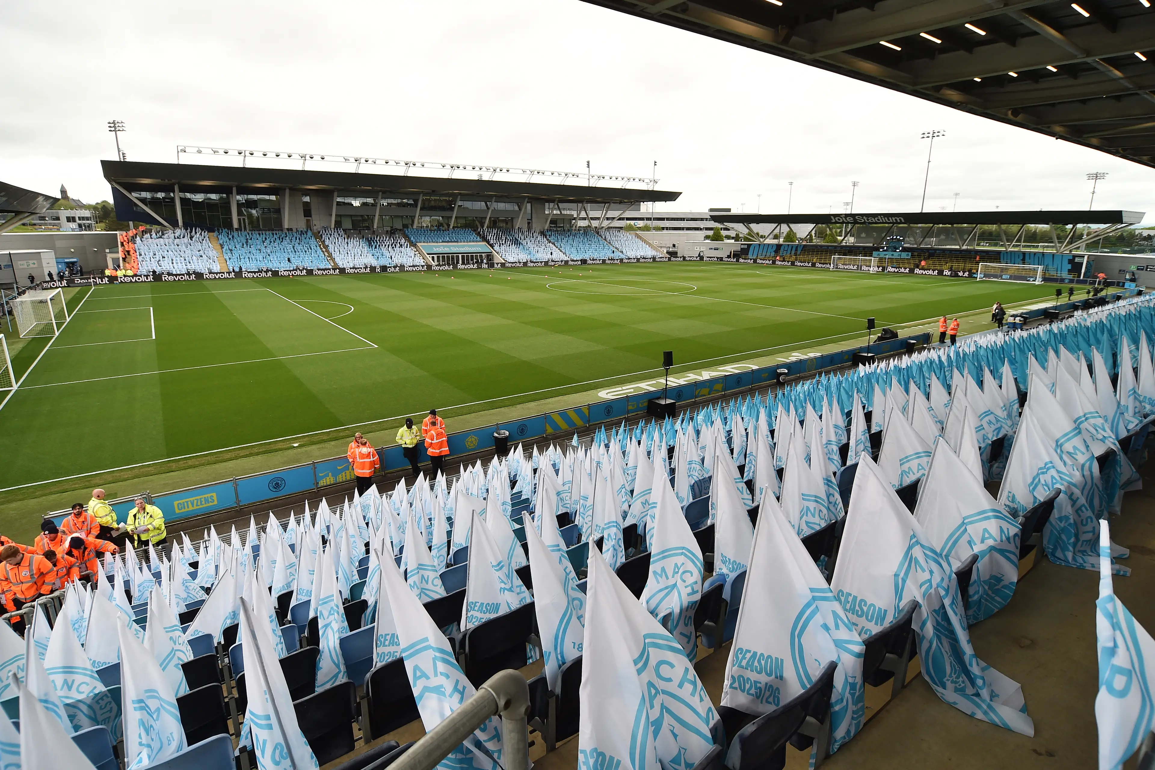 Manchester City flags are left on the seats for supporters ahead of the English Women's Super League football match between Manchester City and Liverpool at Joie Stadium (Getty Images)