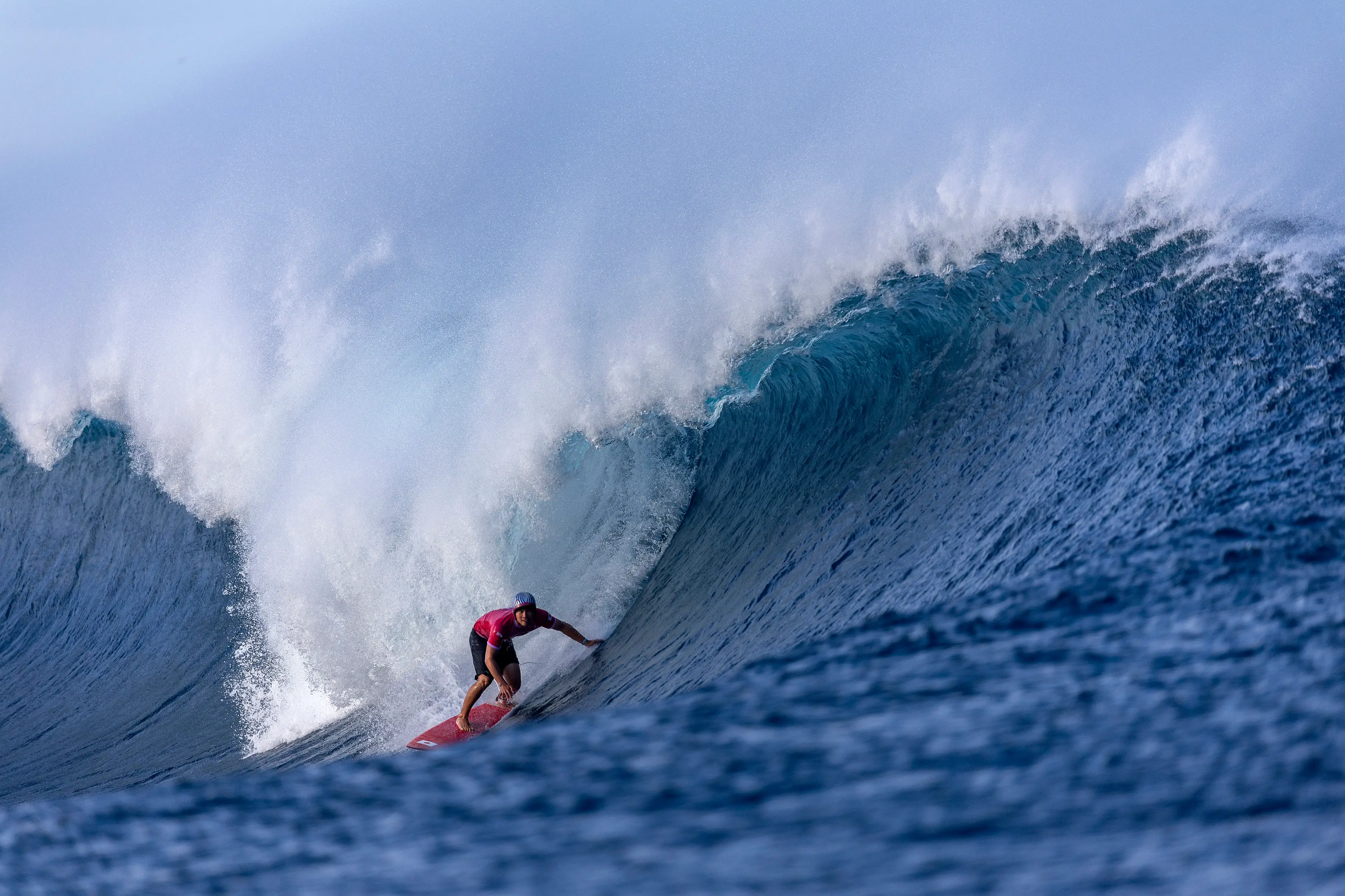 An Olympian rides a wave at Teahupo’o. Image: Getty 