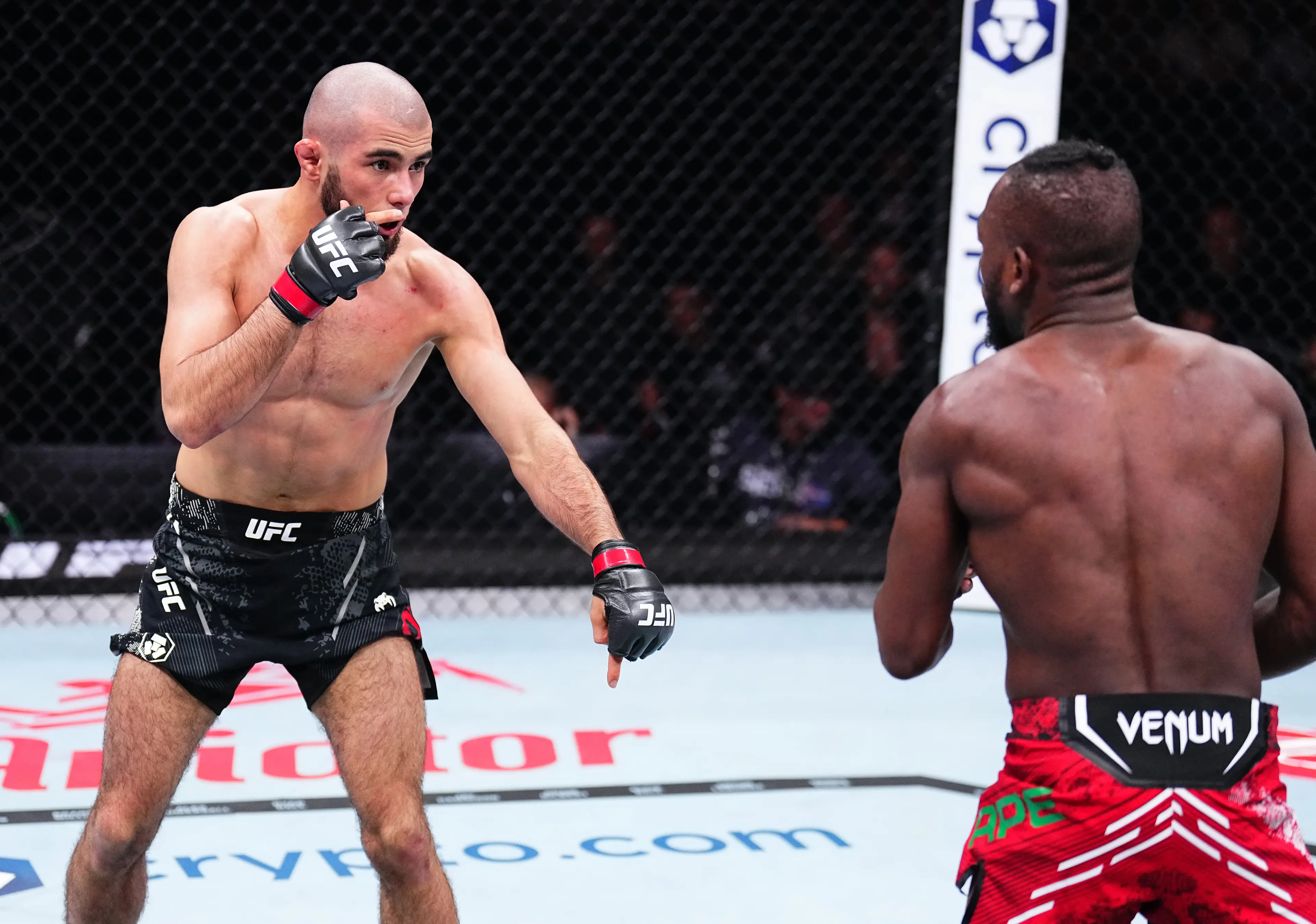 Muhammad Mokaev and Manel Kape during their flyweight bout at UFC 304. Image: Getty 