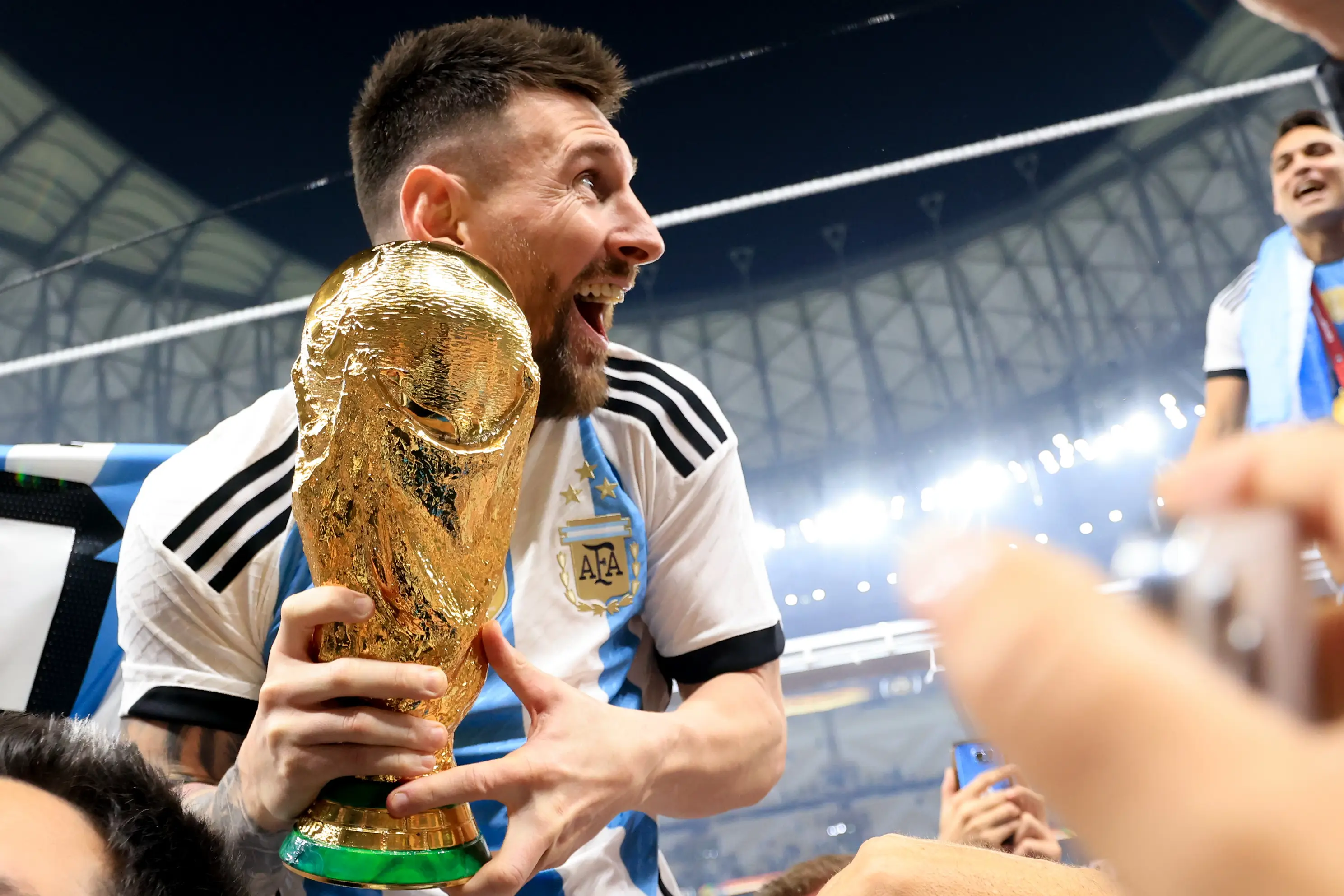 Lionel Messi celebrates winning the World Cup with Argentina. Image: Getty 