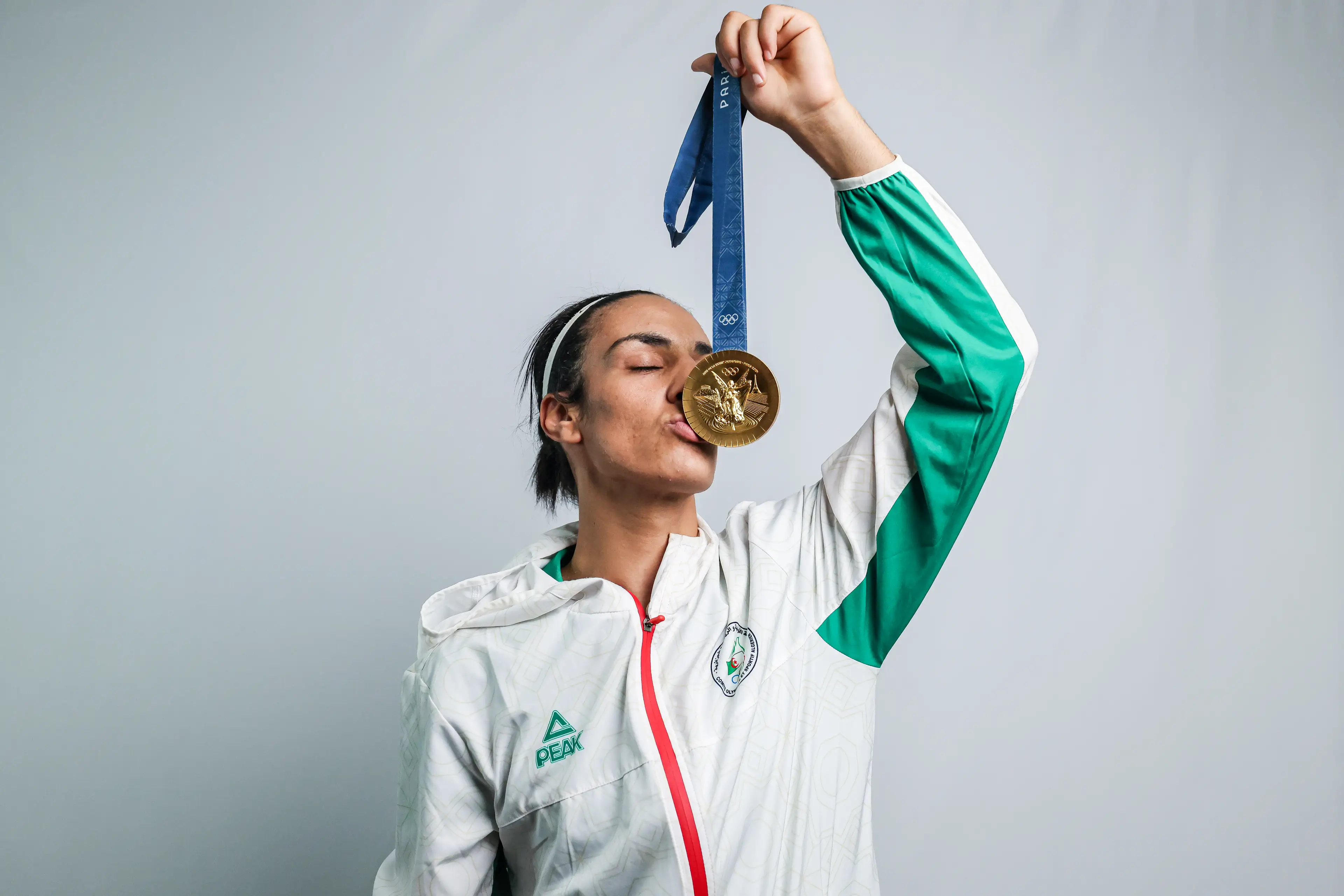 Imane Khelif poses for a portrait with her gold medal after winning the Boxing Women's 66kg Final. Image credit: Getty