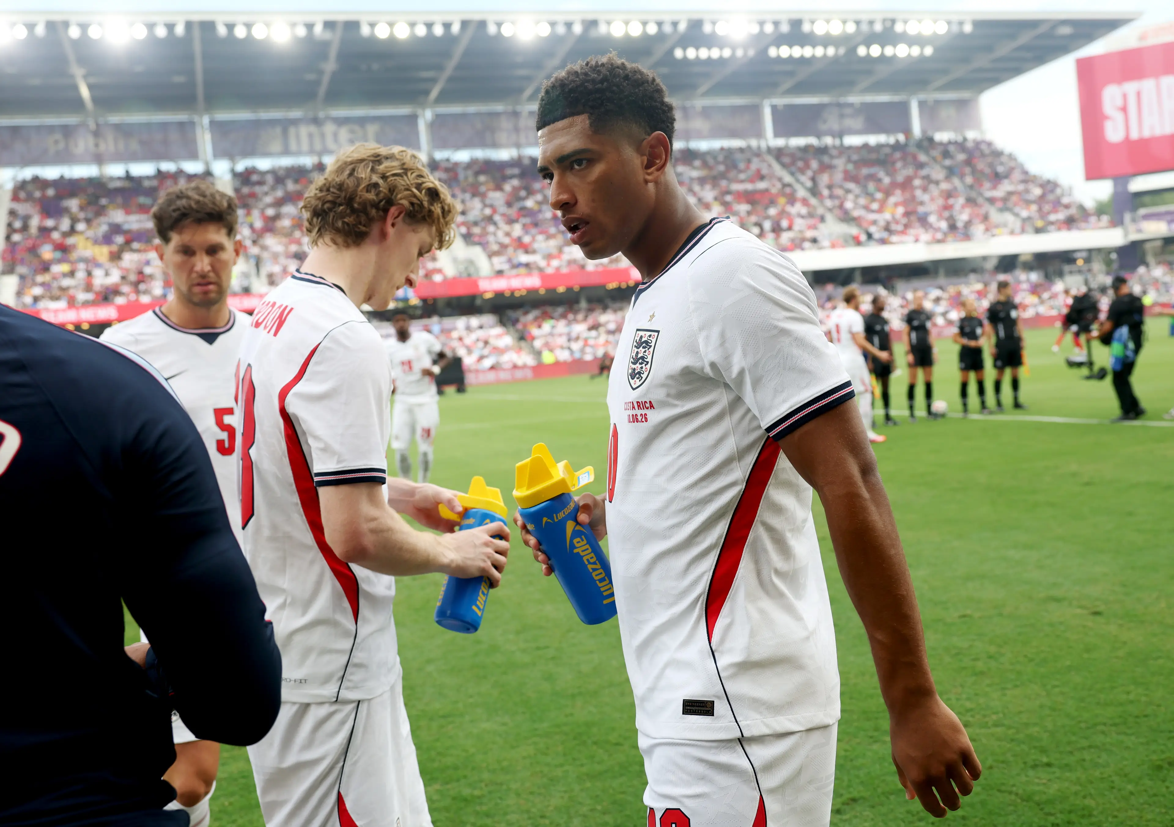 Jude Bellingham takes in fluids during the hydration break vs Costa Rica. Image credit: Getty