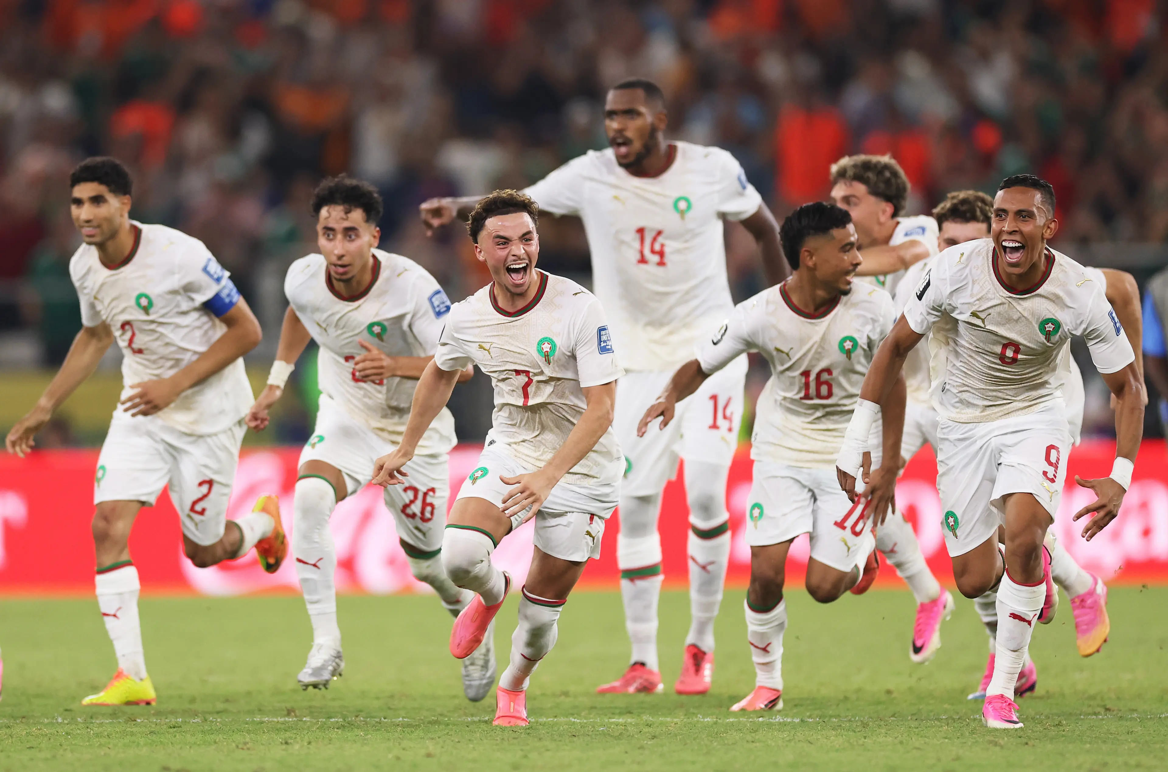 Players of Morocco dash after Ismael Saibari scores the team's winning penalty against the Netherlands. Image credit: Getty