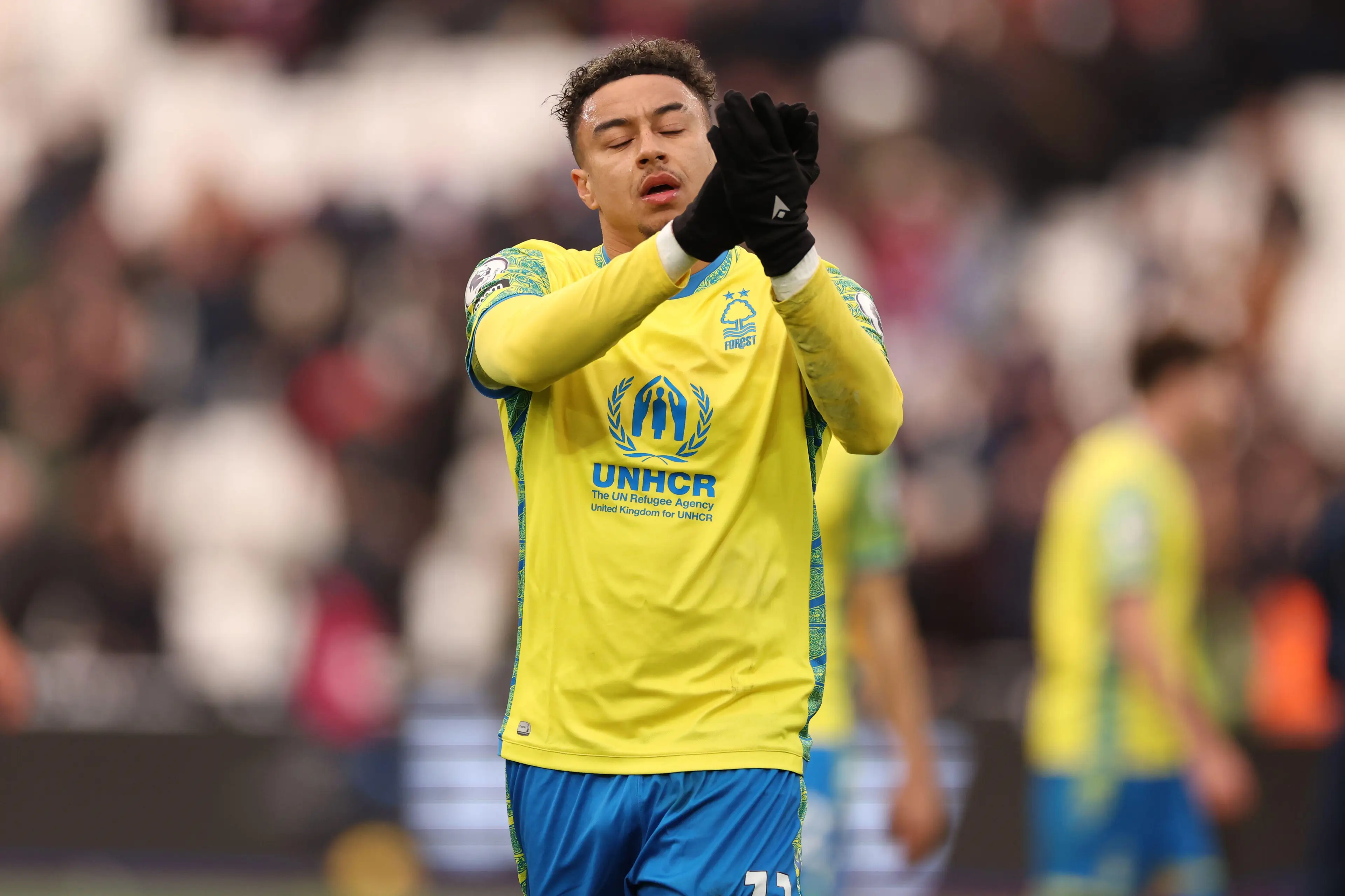 Jesse Lingard applauds the travelling fans after the final whistle. Image: Alamy