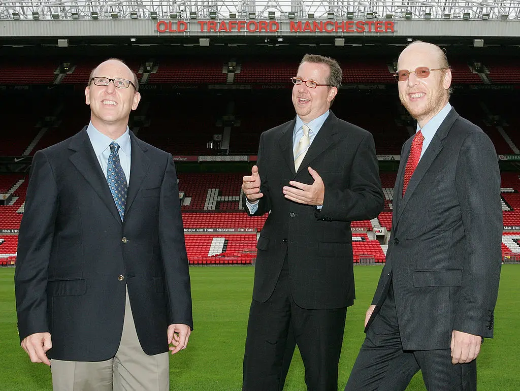 Joel Glazer (left), Avram Glazer (right) and Bryan Glazer (centre) in 2005 (Credit:Getty)