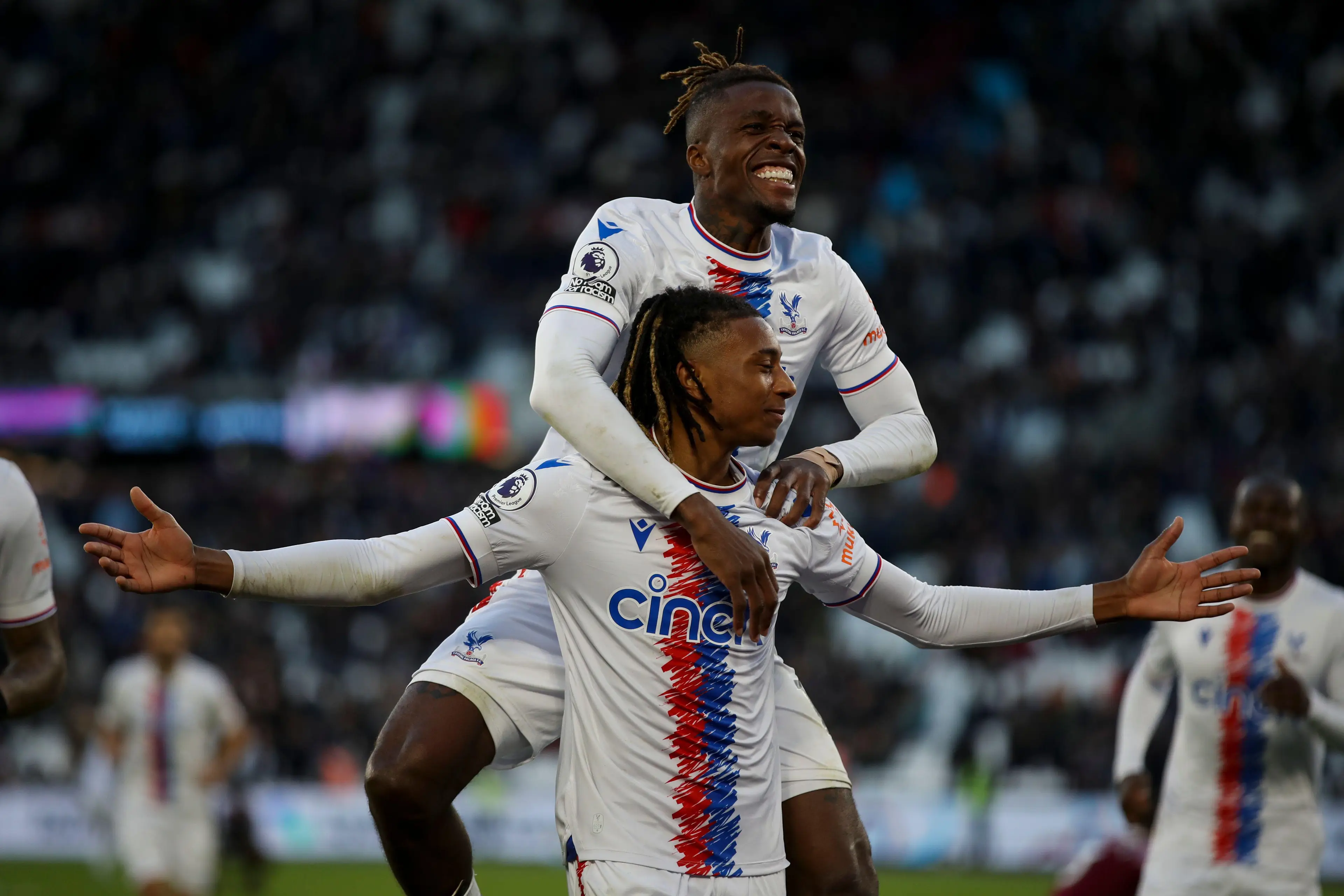 Olise celebrates his winner with Zaha. (Image