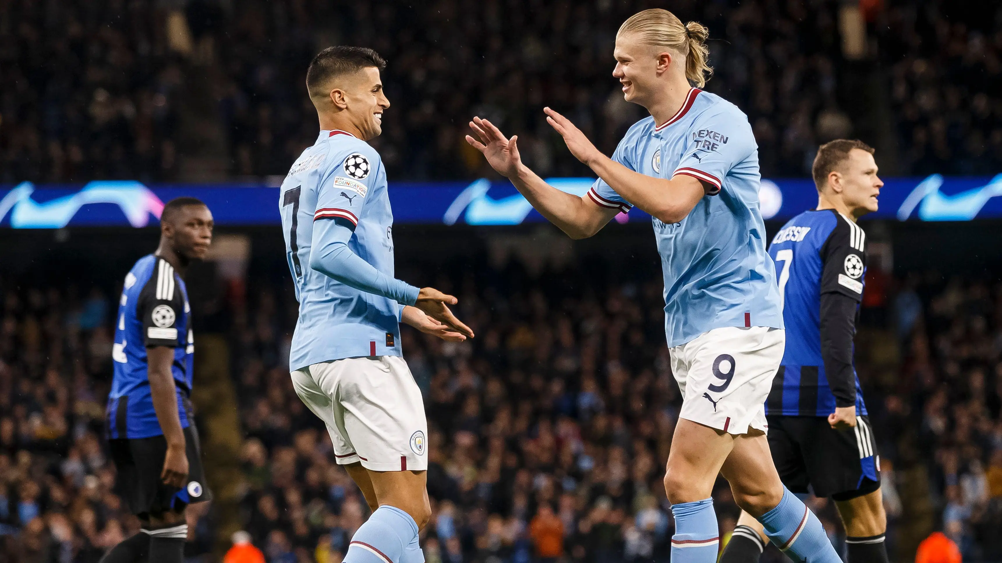 Joao Cancelo and Erling Haaland, Manchester City.
