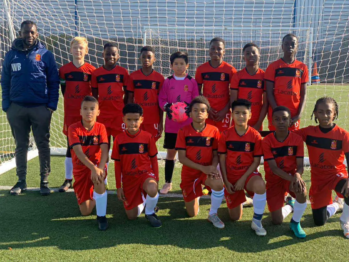 Rio Ngumoha (bottom, third from left) represents the Newham district team when he was in Year 7.