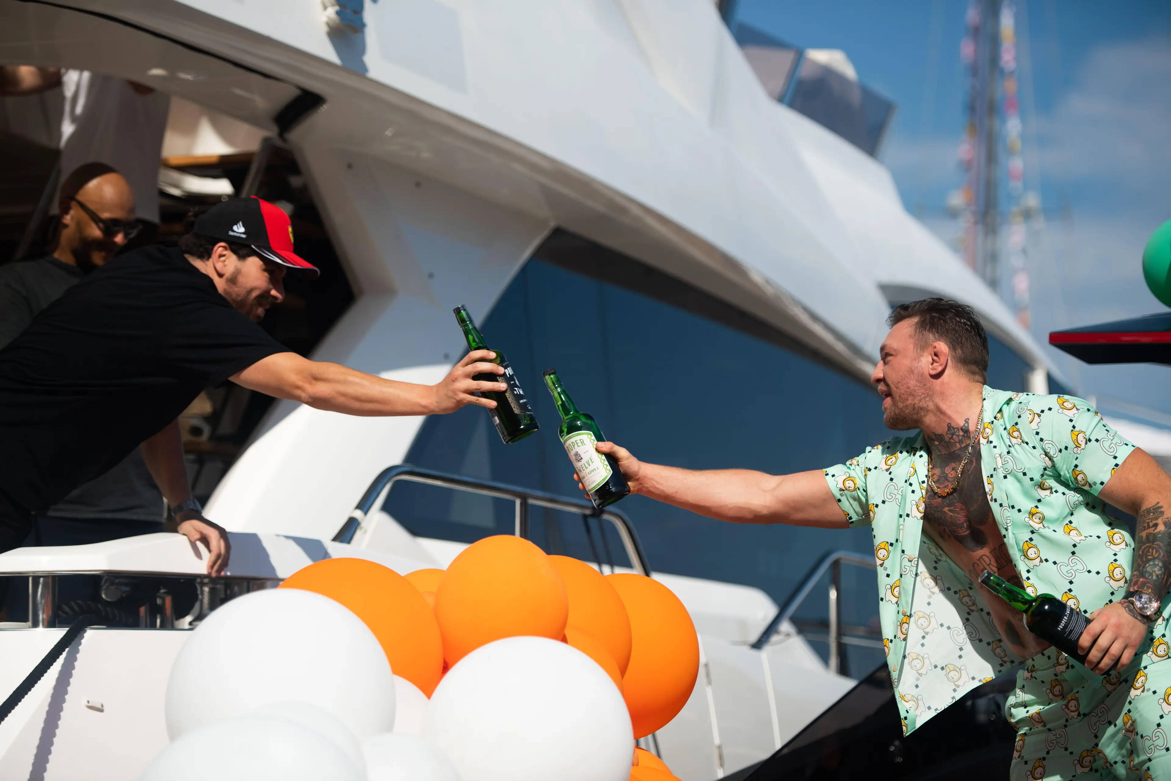 McGregor enjoys a Proper Twelve whiskey with his Monaco 'neighbour.' Image: Alamy