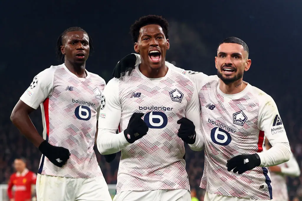Jonathan David celebrates after scoring against Liverpool at Anfield (Image: Getty)