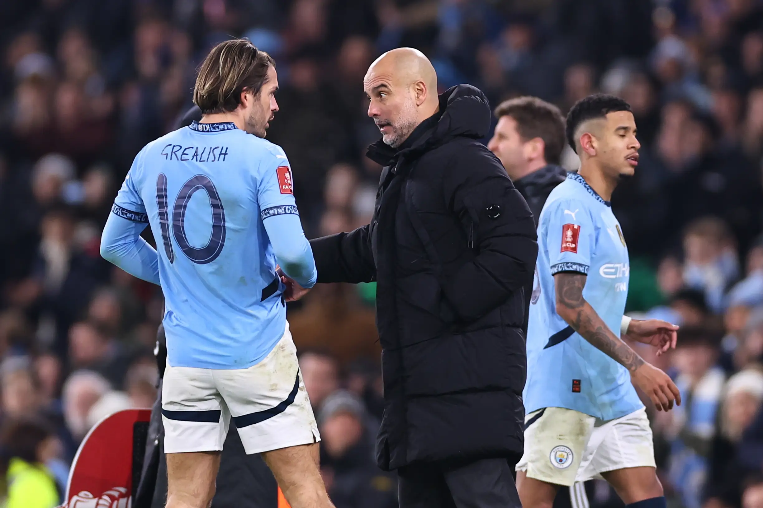 Guardiola and Grealish during City's FA Cup third round win over Salford City. Image credit: Getty