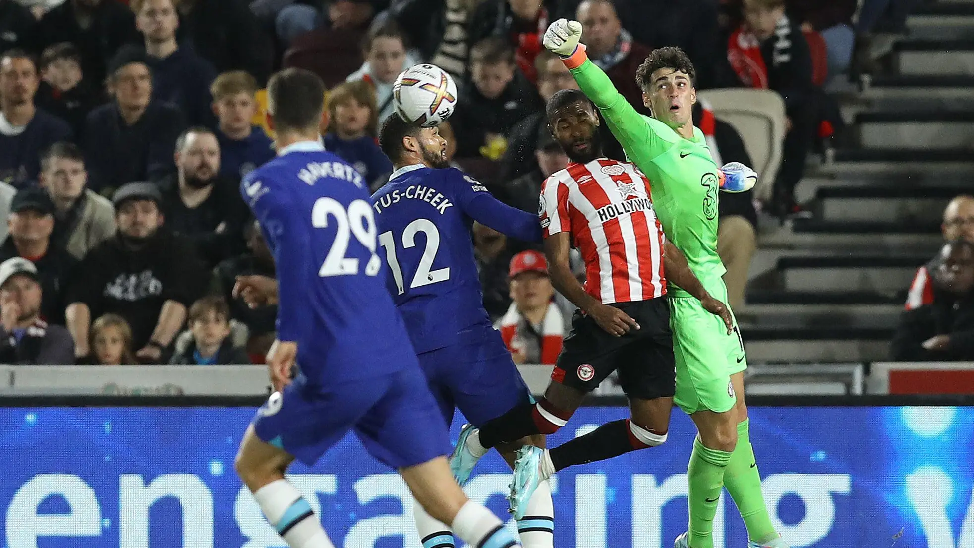 Kepa Arrizabalaga of Chelsea punches the ball clear ahead of Rico Henry of Brentford during the Premier League match. (Alamy)
