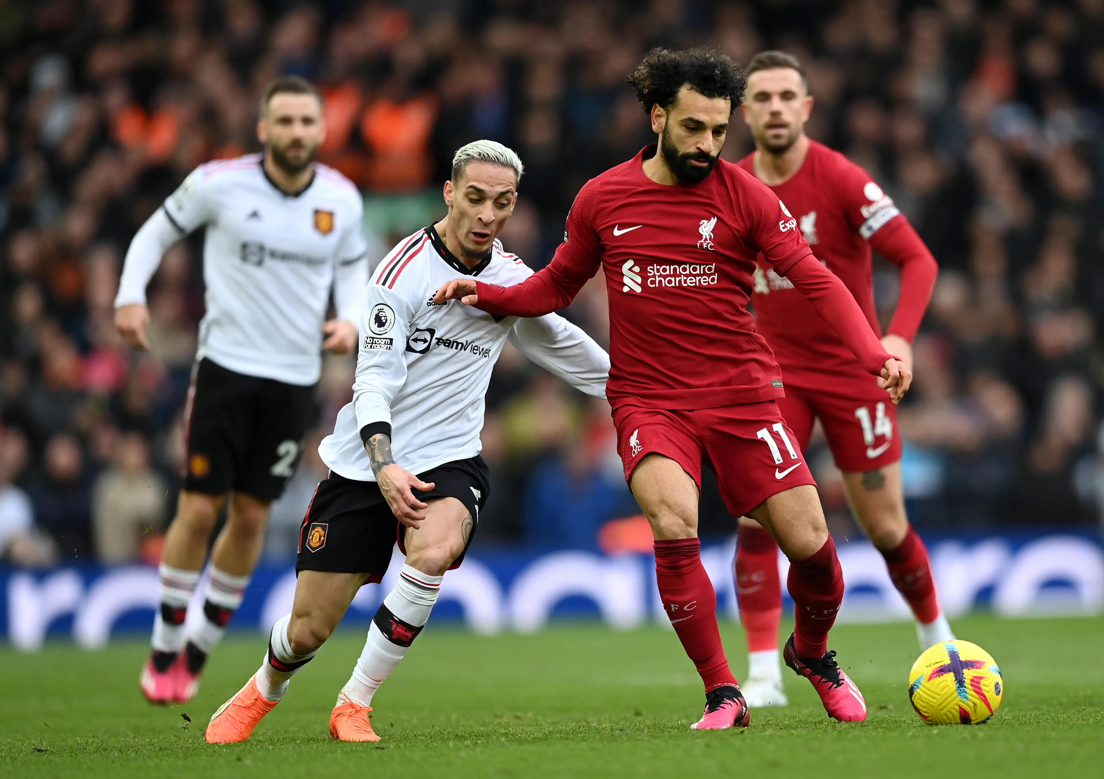Antony and Mohamed Salah duel for the ball during a Premier League fixture. Image: Getty 