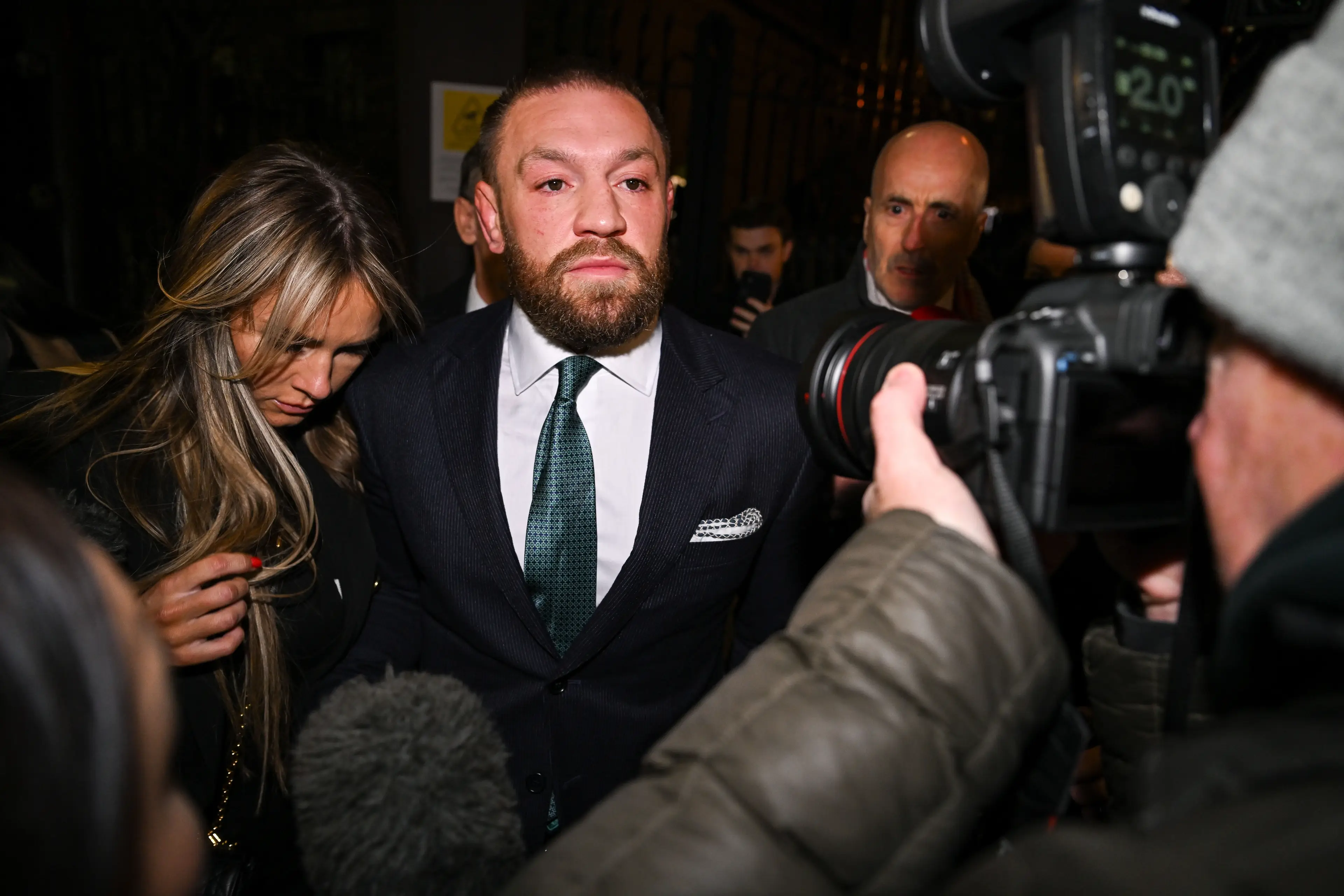 Conor McGregor leaves court, accompanied by his partner Dee Devlin, after the court announced the jury's decision in the civil action case. Image credit: Getty