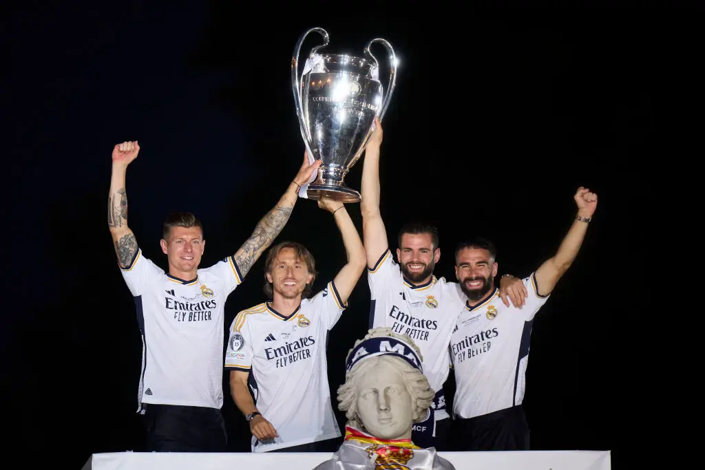 Toni Kroos celebrates with team-mates Luka Modric, Nacho Fernandez and Dani Carvajal during Real Madrid's 2024 Champions League trophy parade (