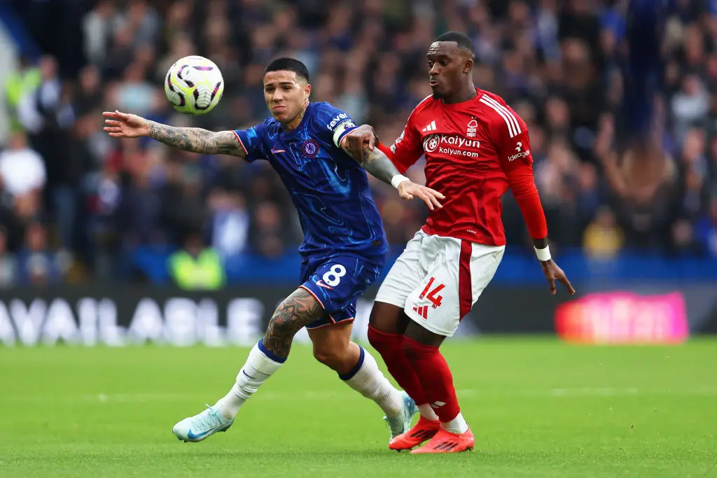 Chelsea's Enzo Fernandez battles for the ball against Nottingham Forest's Callum Hudson-Odoi - Getty