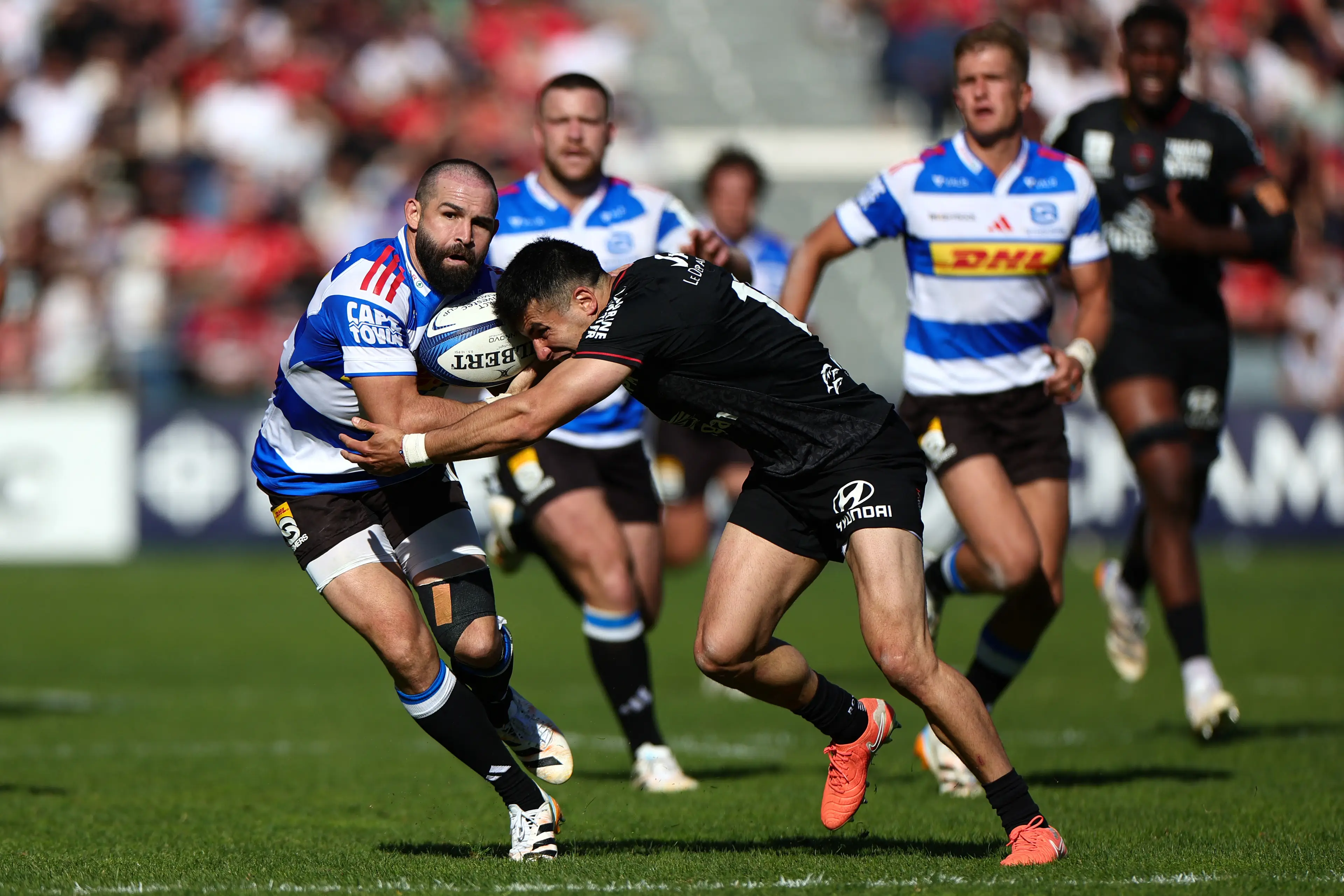 Stormers' South African scrum-half Cobus Reinach is tackled by Toulon's Argentine fly-half Tomas Albornoz during the European Rugby Champions Cup round of 16 rugby union match (Getty Images)