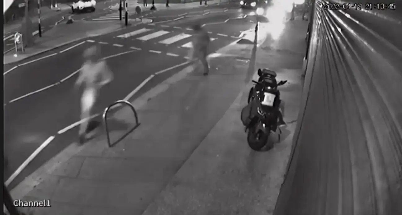 The two men sprinting from the scene.