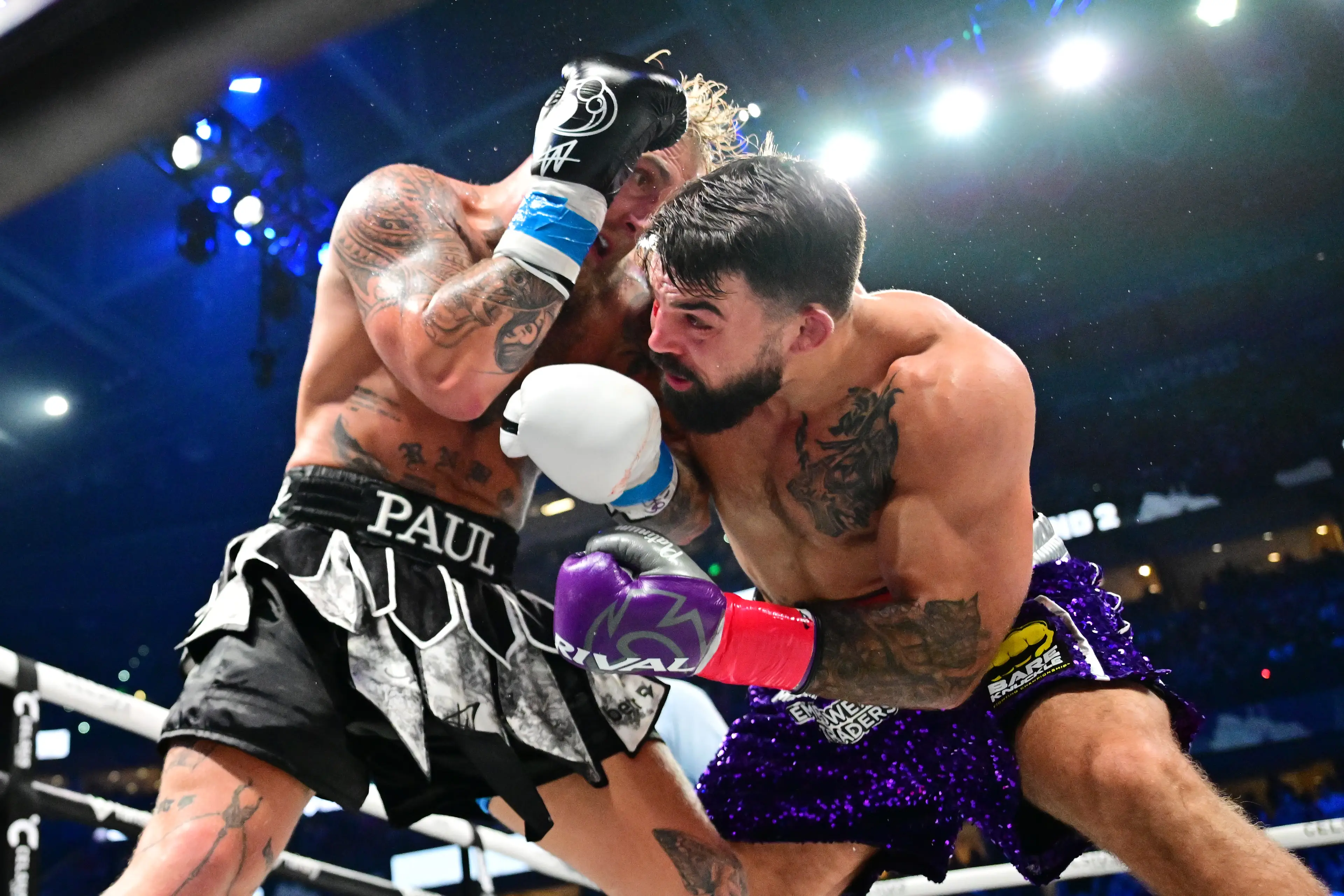 Jake Paul and Mike Perry during their bout. Image: Getty 