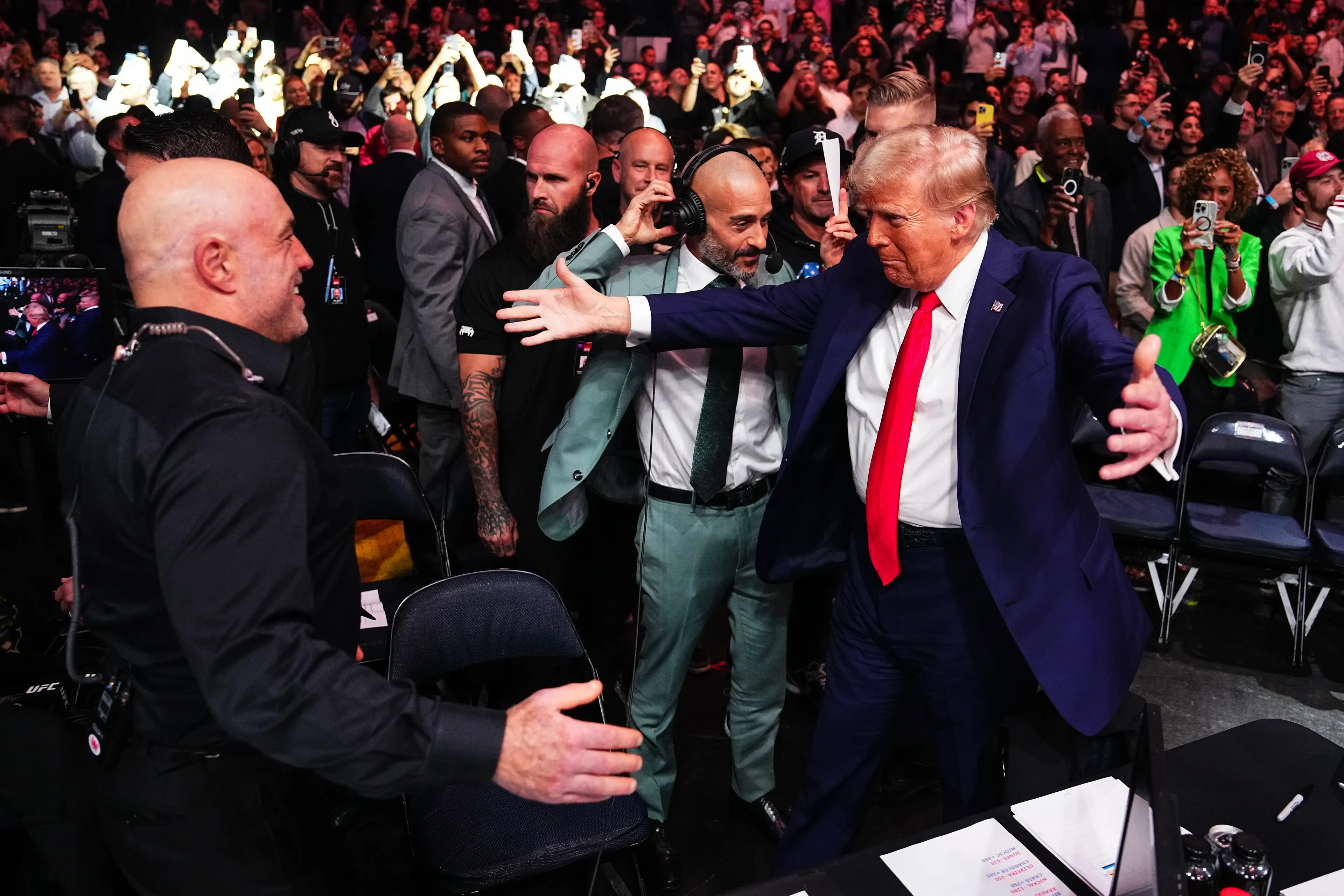 Donald Trump shares a warm embrace with Joe Rogan at UFC 309. Image: Getty 