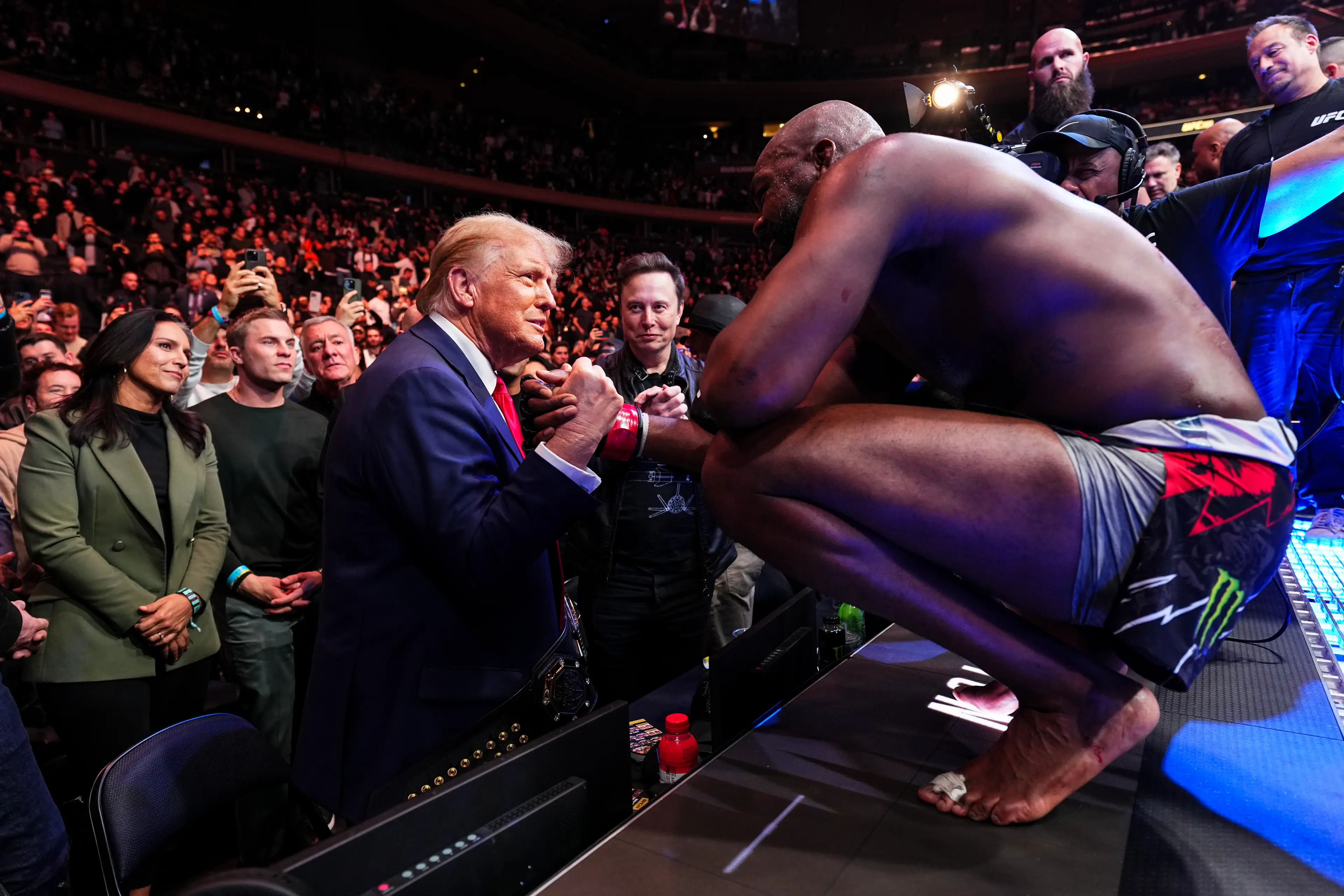 Jon Jones and Donald Trump share a warm embrace at UFC 309. Image: Getty