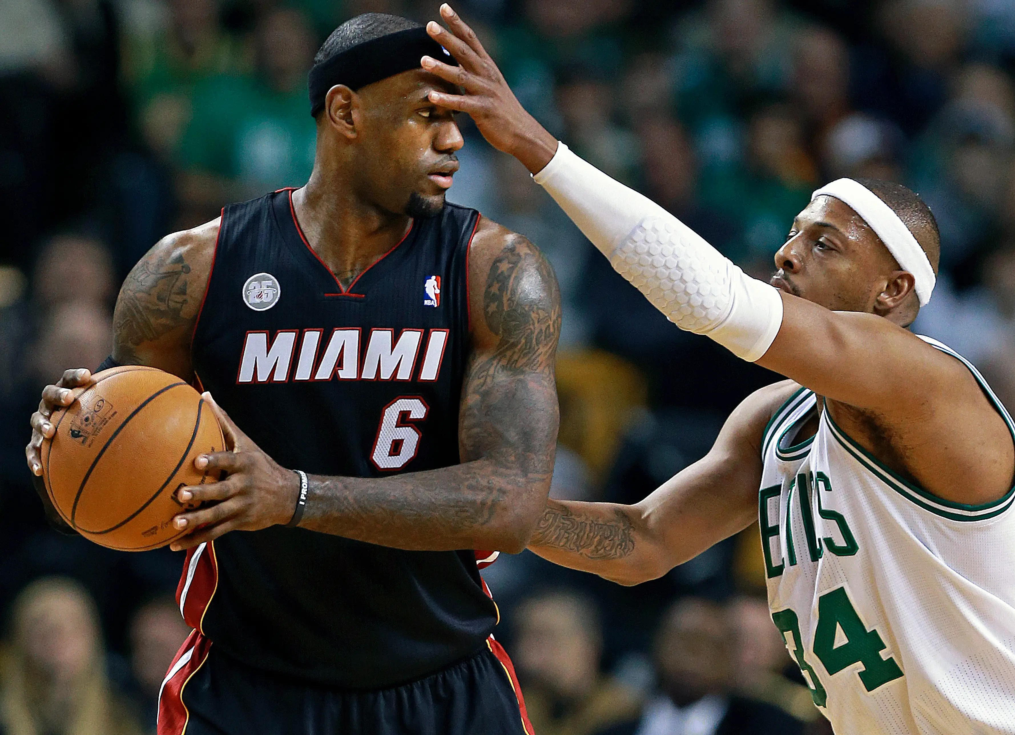 LeBron James of the Miami Heat guarded by Paul Pierce of the Boston Celtics