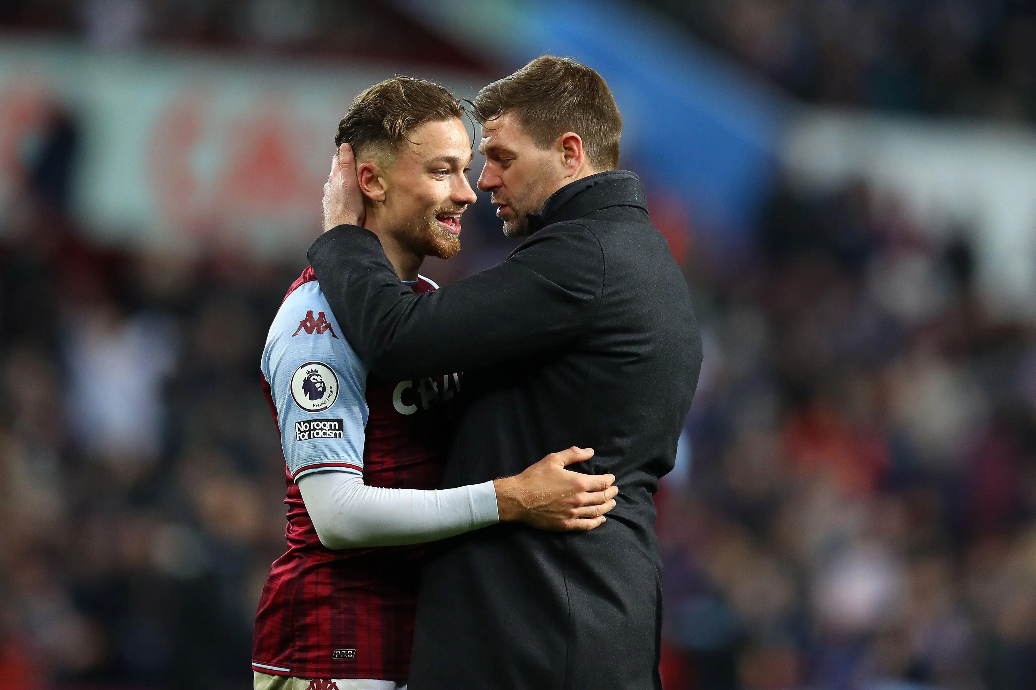 Gerrard with Matty Cash. (Image