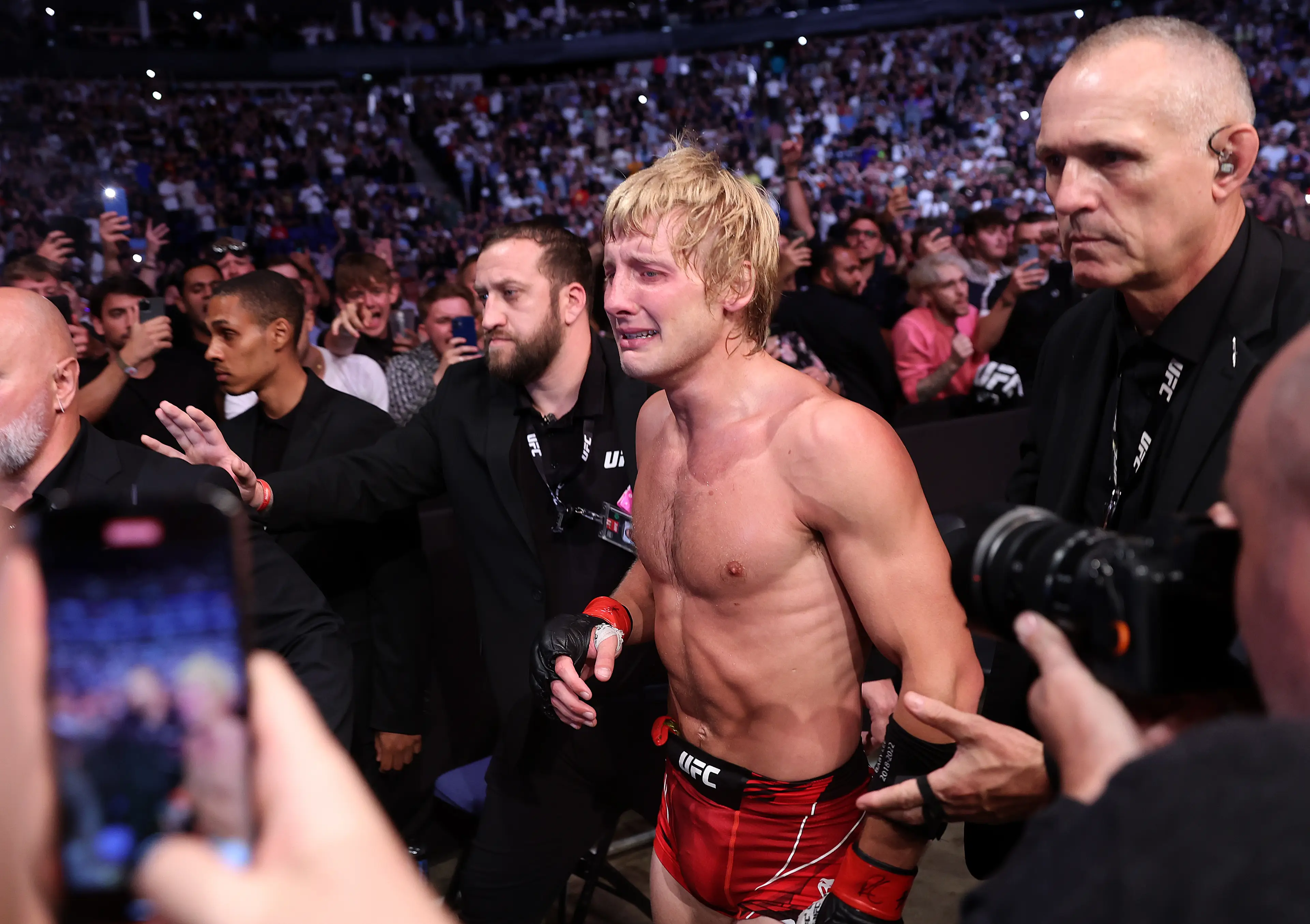 Paddy Pimblett leaves the Octagon in tears after giving an emotional speech about mental health. Image: Getty 