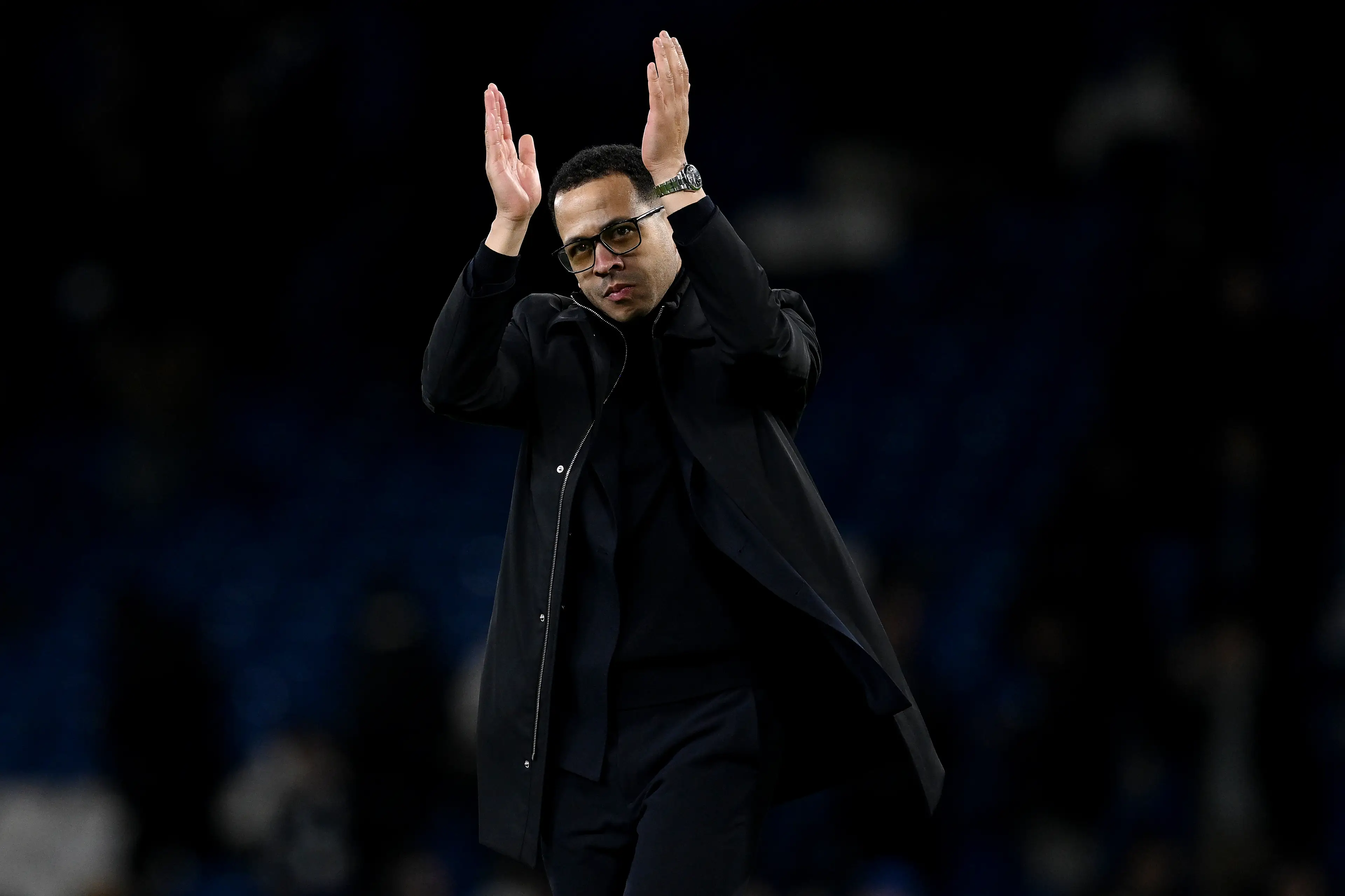 Liam Rosenior applauds Chelsea fans inside Stamford Bridge following their defeat to Arsenal. Image: Getty