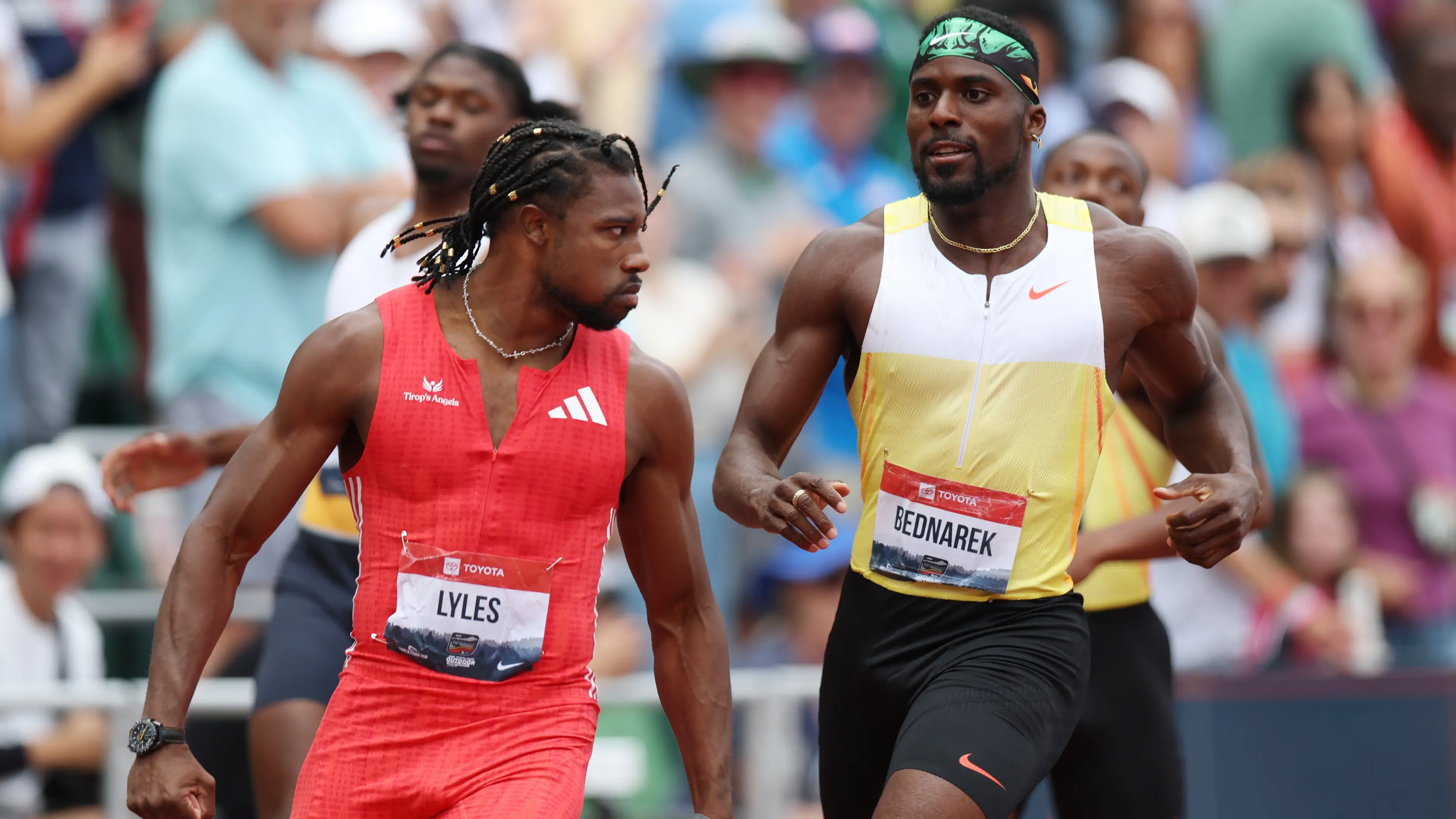 Noah Lyles reacts after winning the Xfinity Men's 200m final in front of Kenny Bednarek