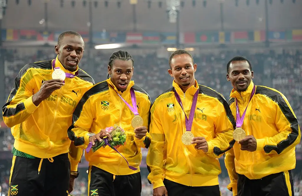 Yohan Blake (left-of-centre) helped Jamaica win two 4×100 metres Olympic gold medals. (Credit:Getty)