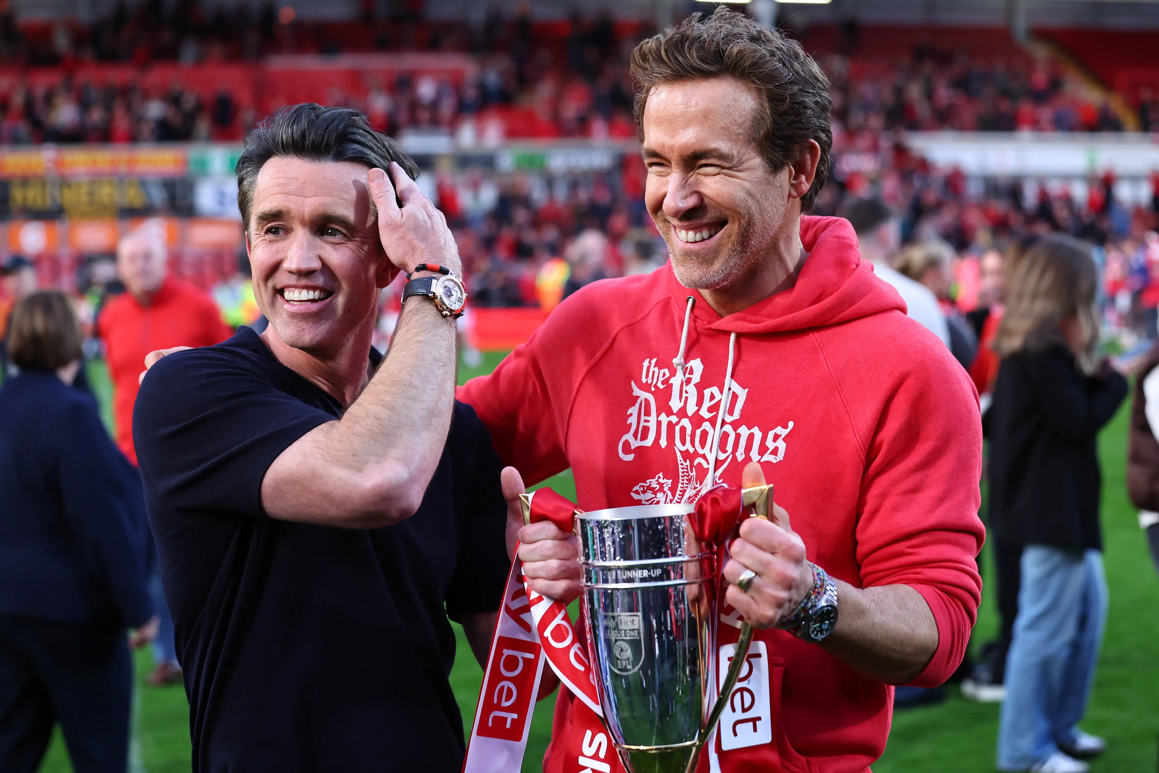 Rob McElhenney and Ryan Reynolds celebrate Wrexham's promotion to the Championship. Image: Getty 