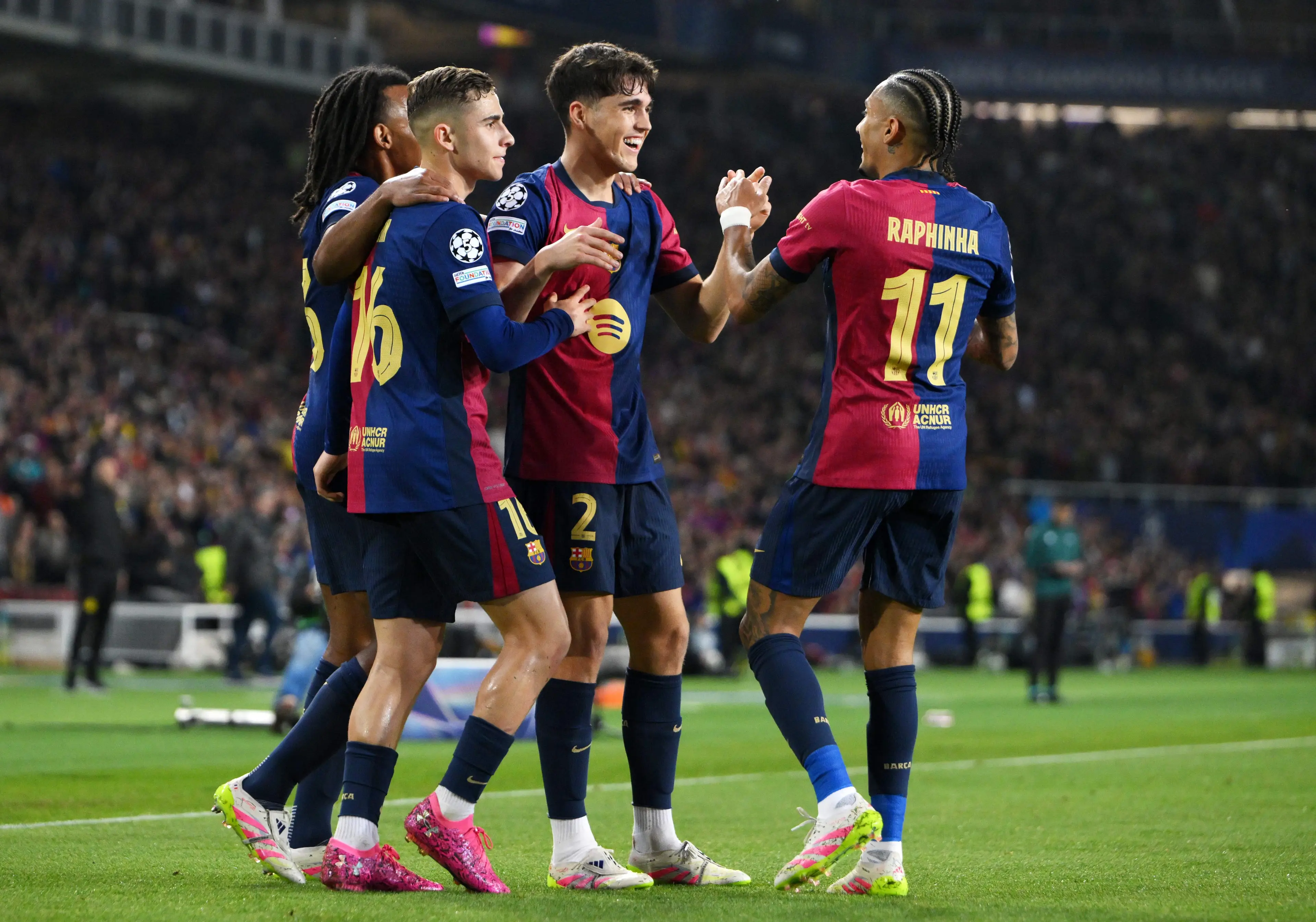 Raphinha and Cubarsi smile after Barcelona went 1-0 up against Borussia Dortmund. Image: Getty